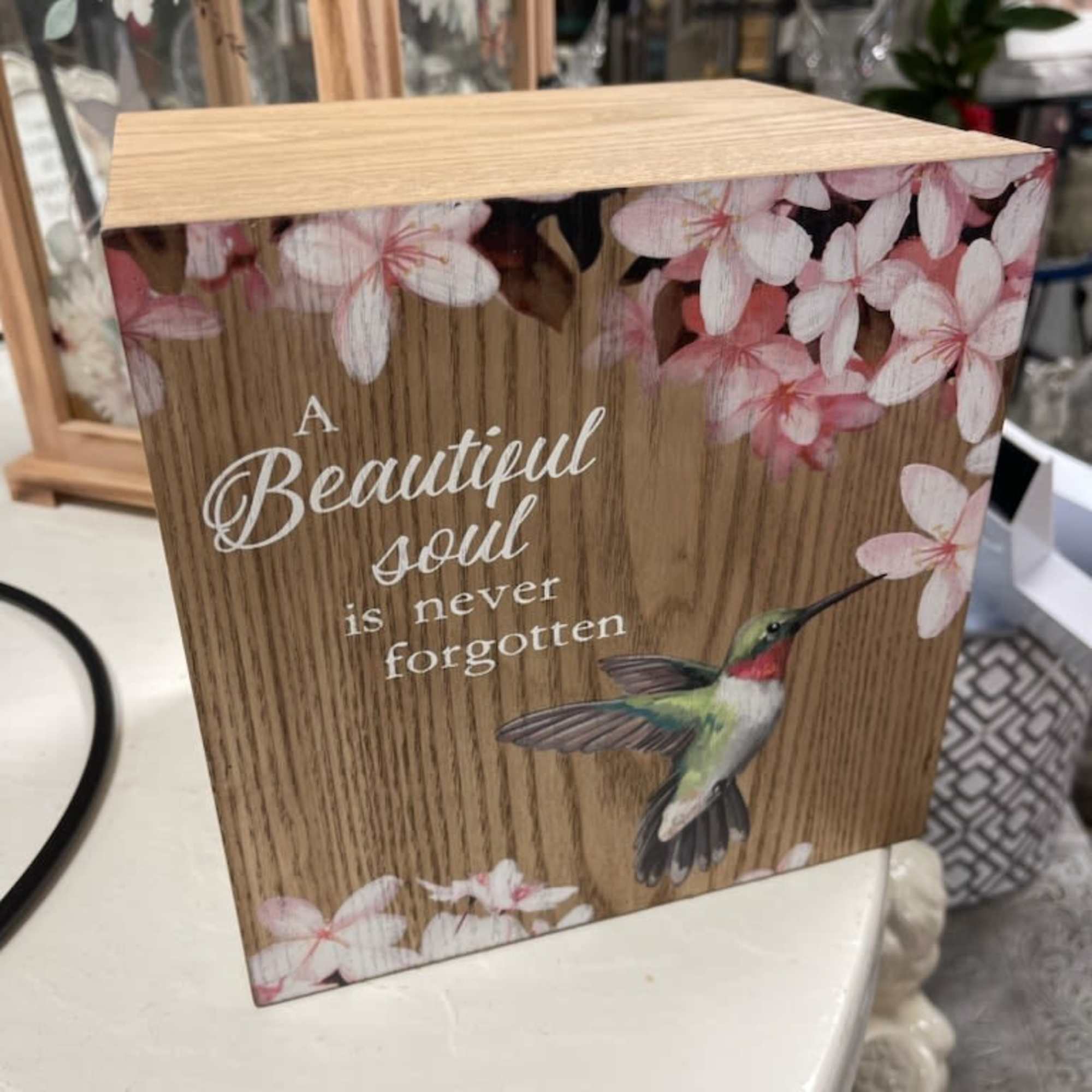 Wooden memorial box with pink blossoms and a hummingbird design