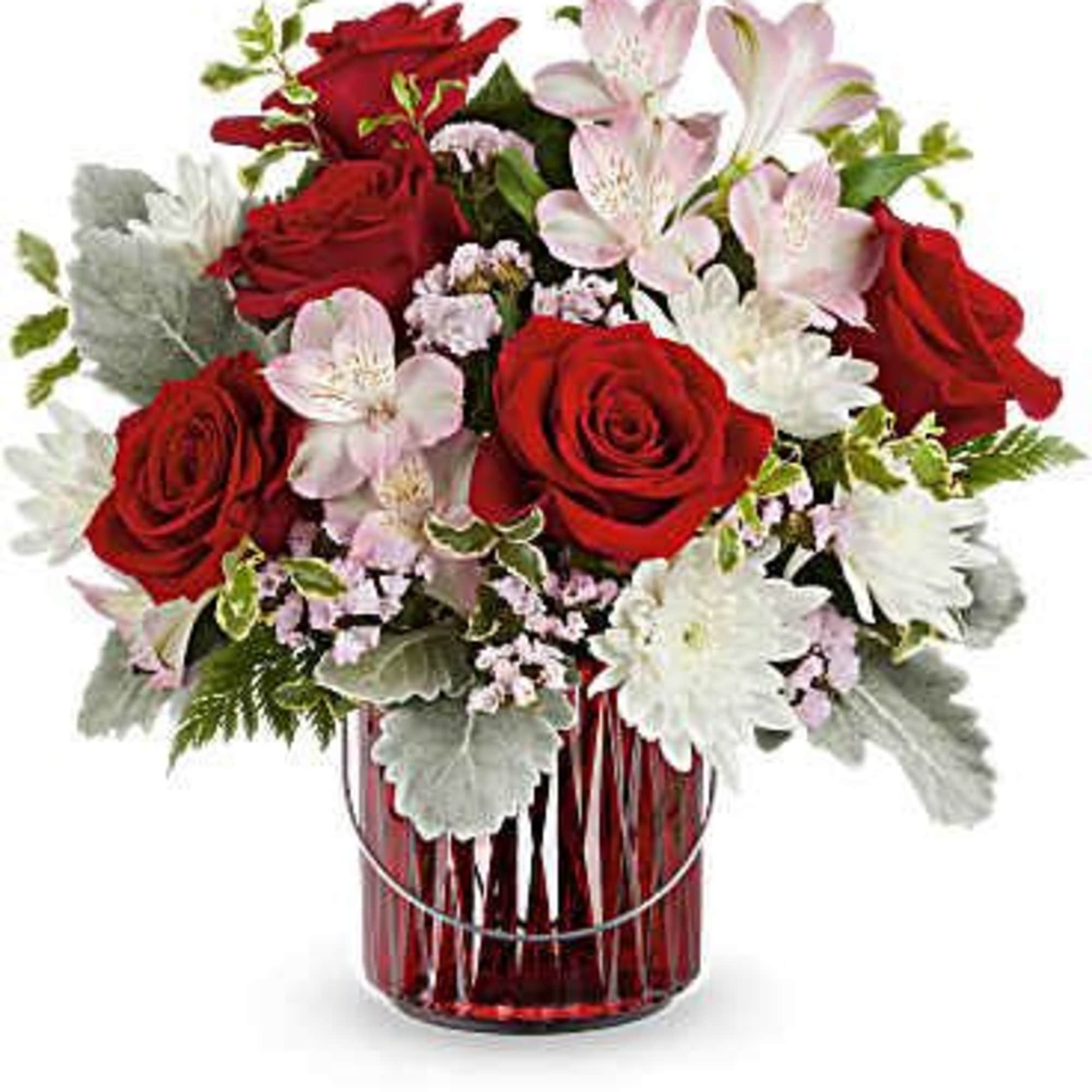 Red roses and pale pink lilies in a red glass vase