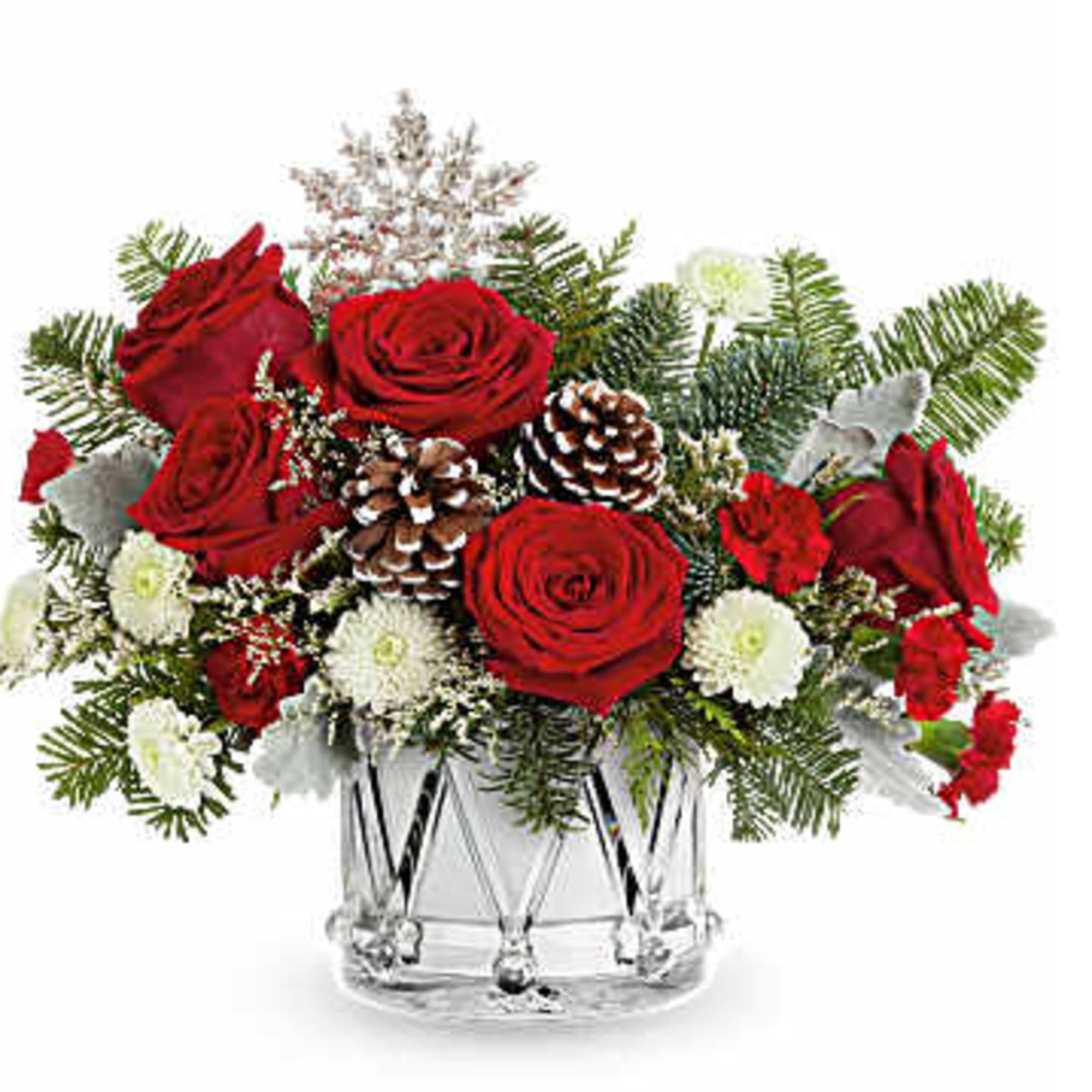 Red roses and white flowers arranged in a clear glass vase