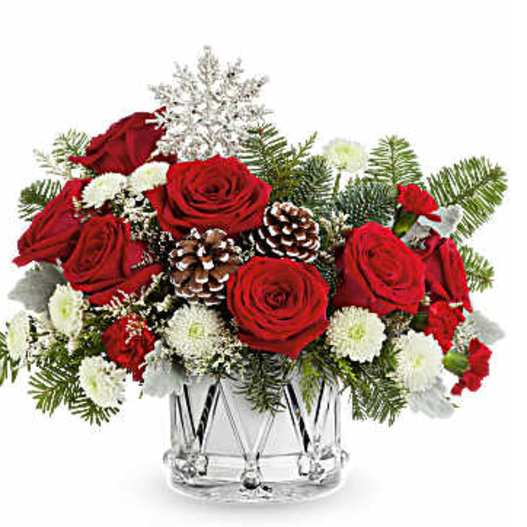 Red roses and white flowers arranged in a clear glass vase