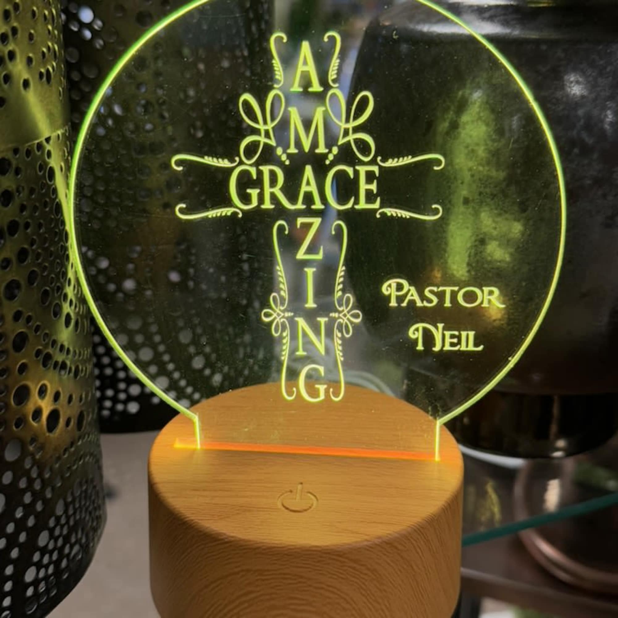 Engraved acrylic light with the words "Amazing Grace" and "Pastor Neil"