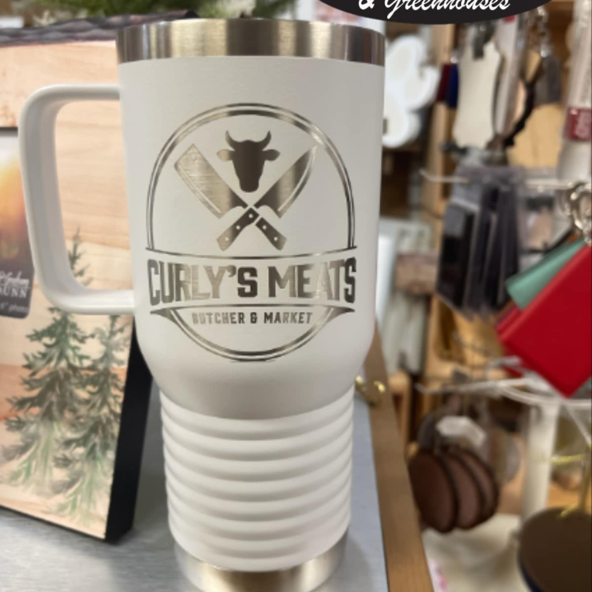 White insulated travel mug with a butcher shop logo