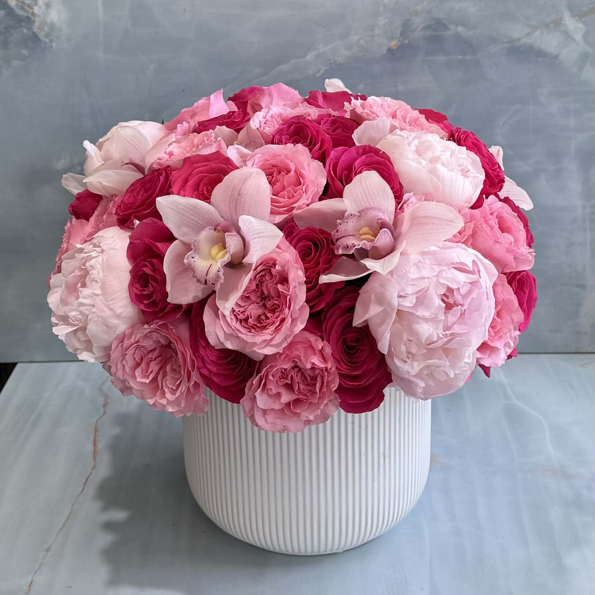 A stunning expression of elegance and romance, this lavish arrangement features layers
