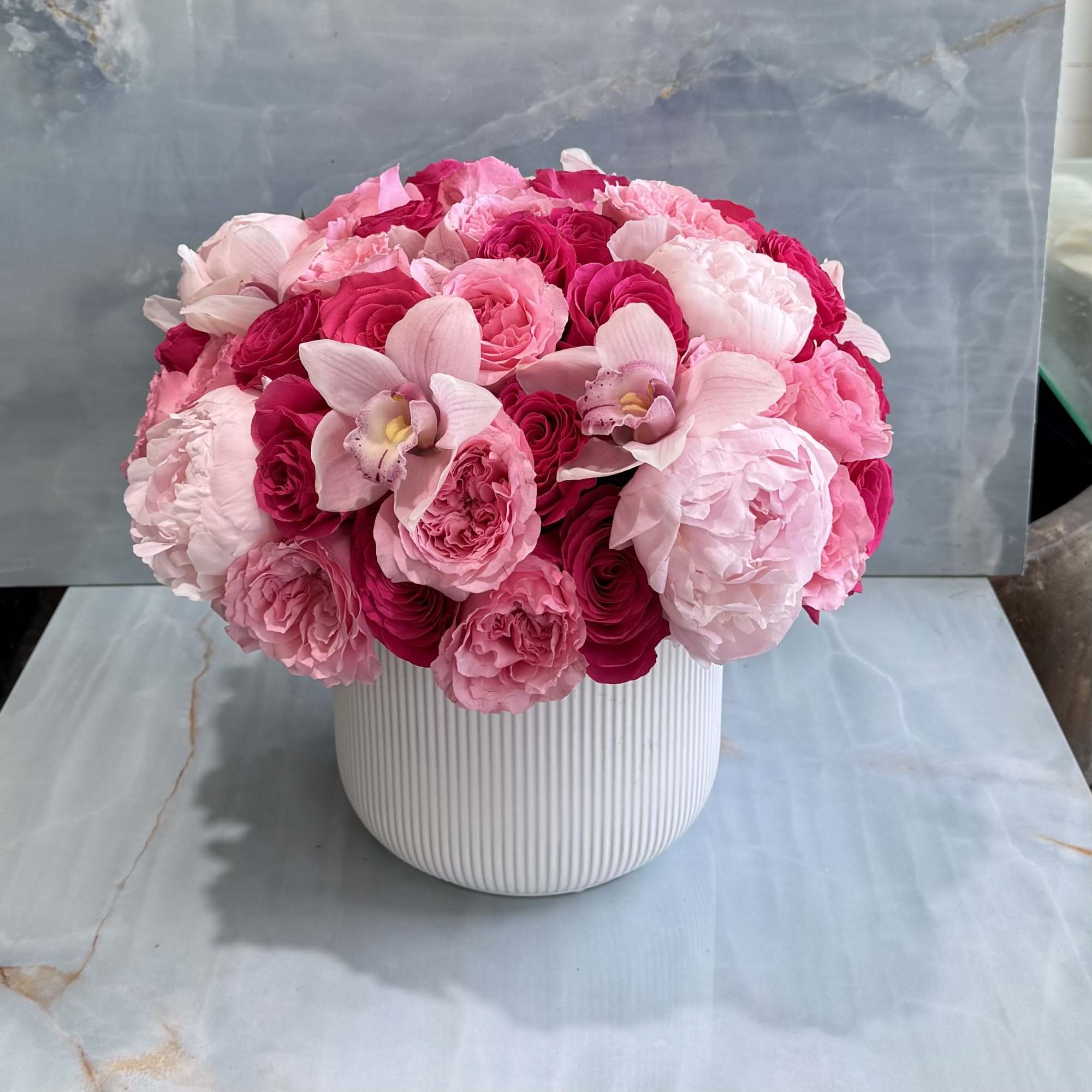 A stunning expression of elegance and romance, this lavish arrangement features layers