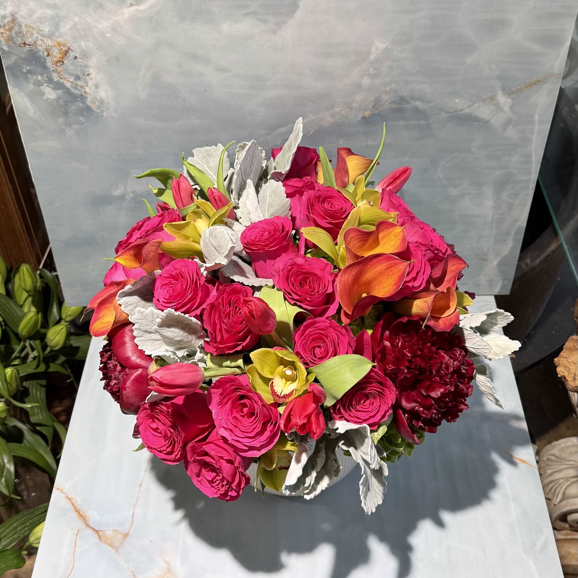 Bold, vibrant, and impossible to overlook. This luxurious arrangement brings together hot