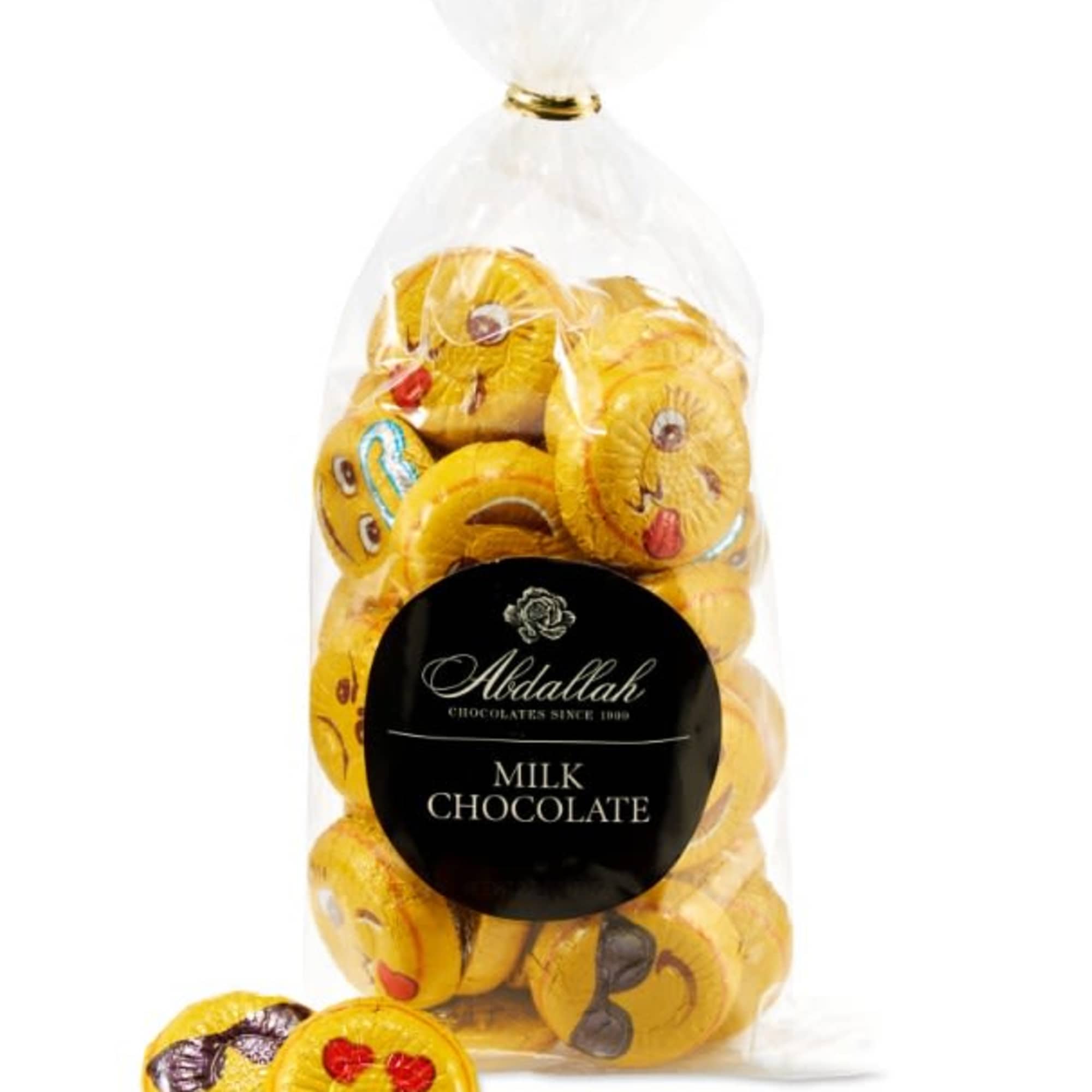 Bag of milk chocolate coins wrapped in yellow emoji foil with two pieces in front.