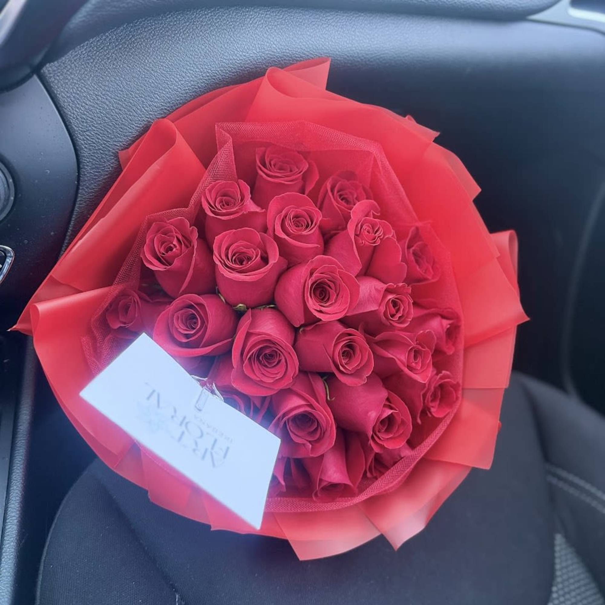 An elegant and sophisticated arrangement of fresh red roses, designed to express