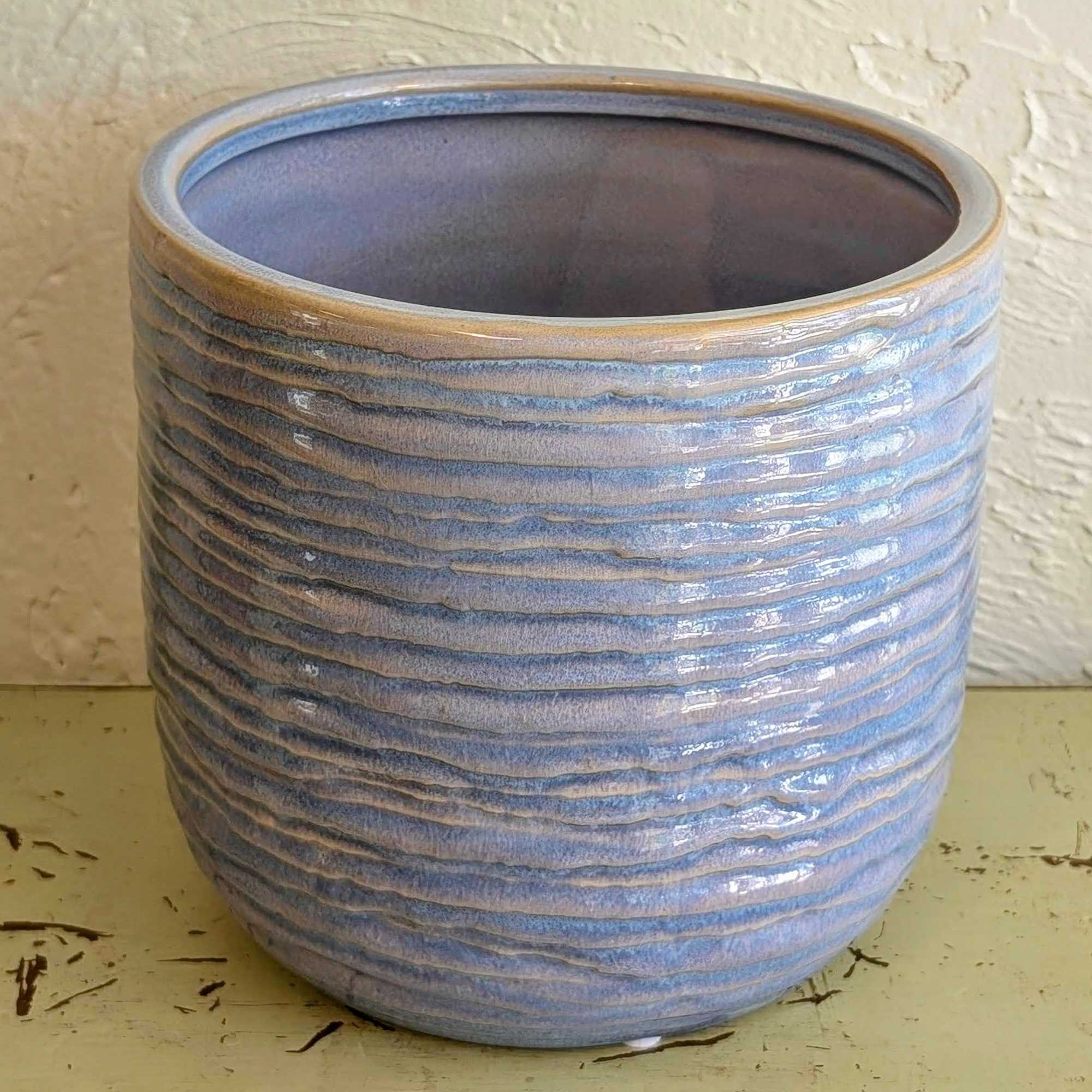 Round blue textured ceramic planter with horizontal ridges