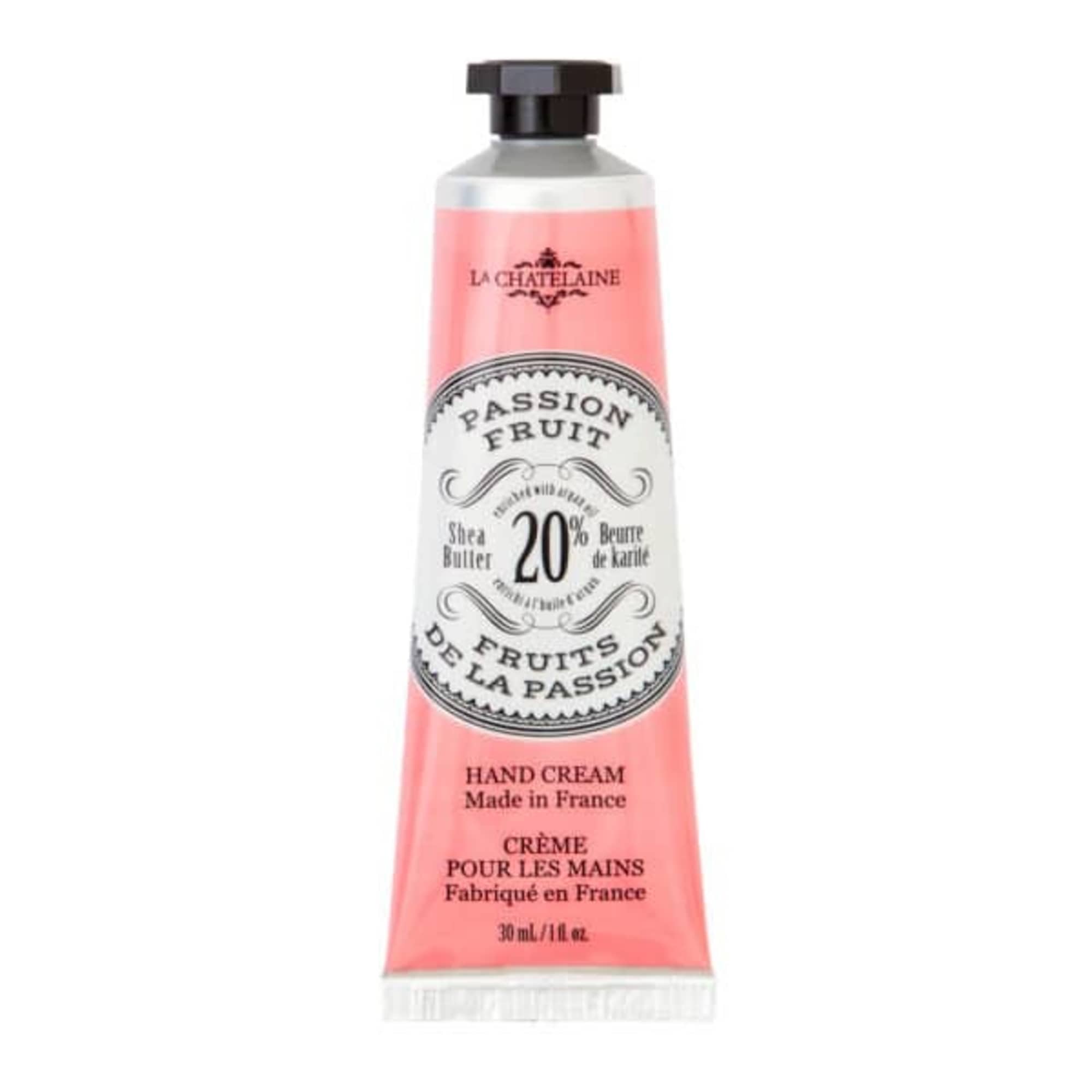 Pink hand cream tube with black cap and French label