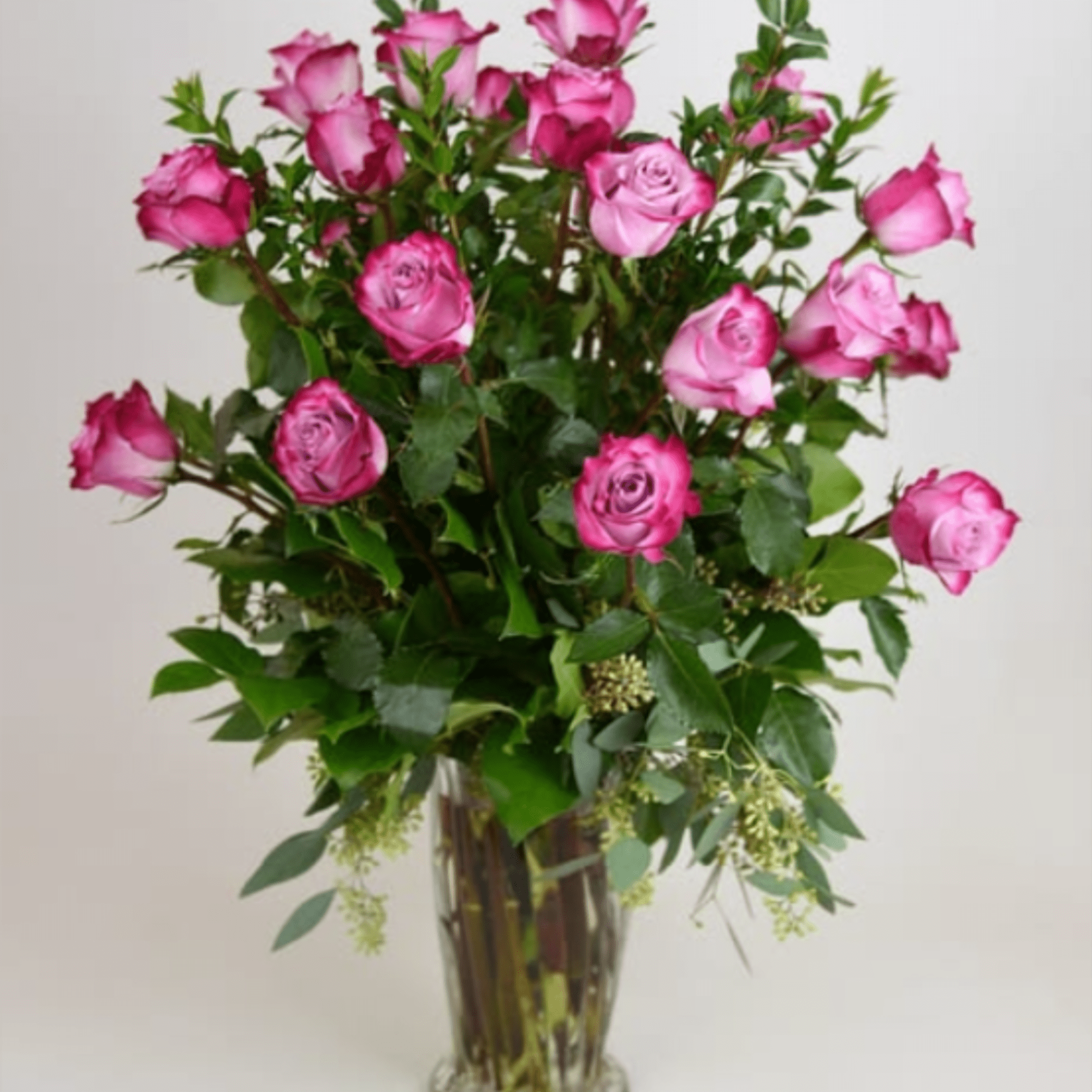 A tall, airy cluster of pink roses in shades from soft blush