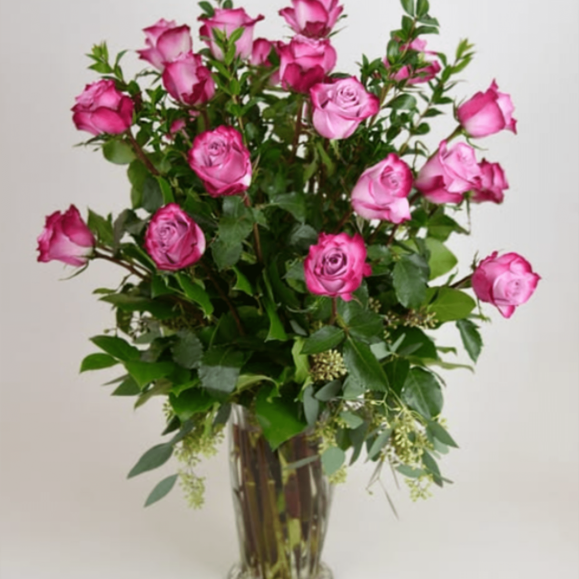 A tall, airy cluster of pink roses in shades from soft blush