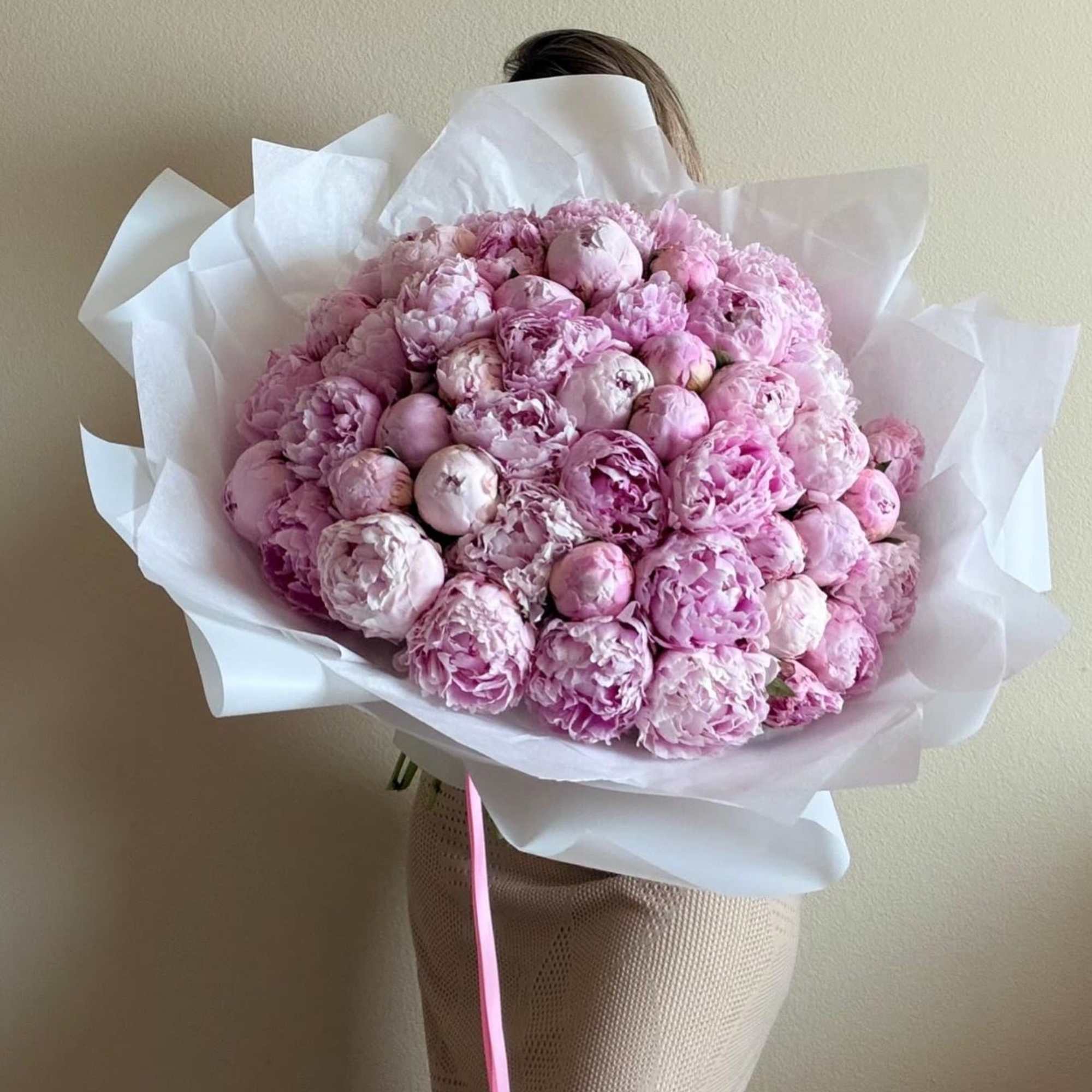 Fifty blushing peonies create a cloudlike, romantic statement perfect for a birthday