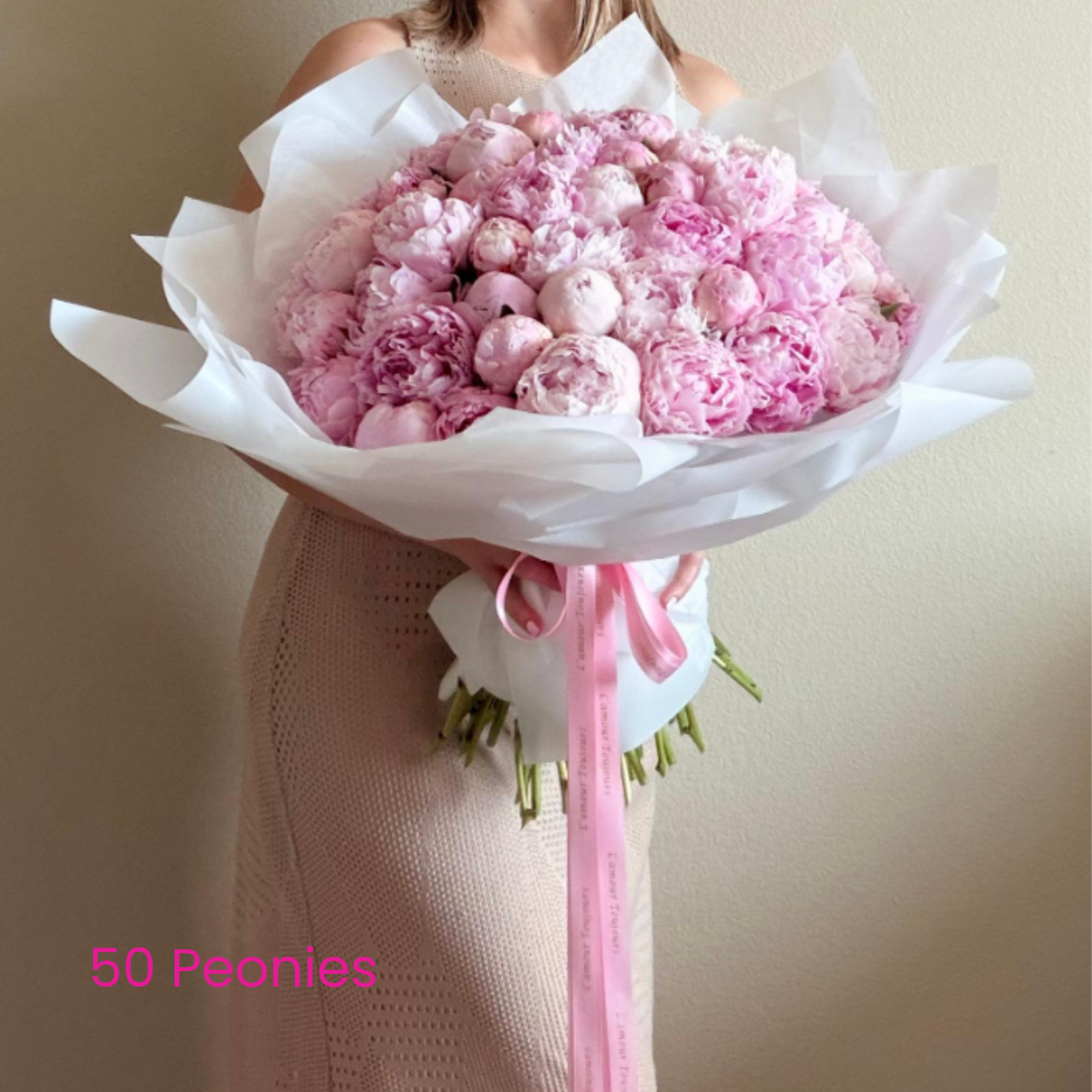 Fifty blushing peonies create a cloudlike, romantic statement perfect for a birthday