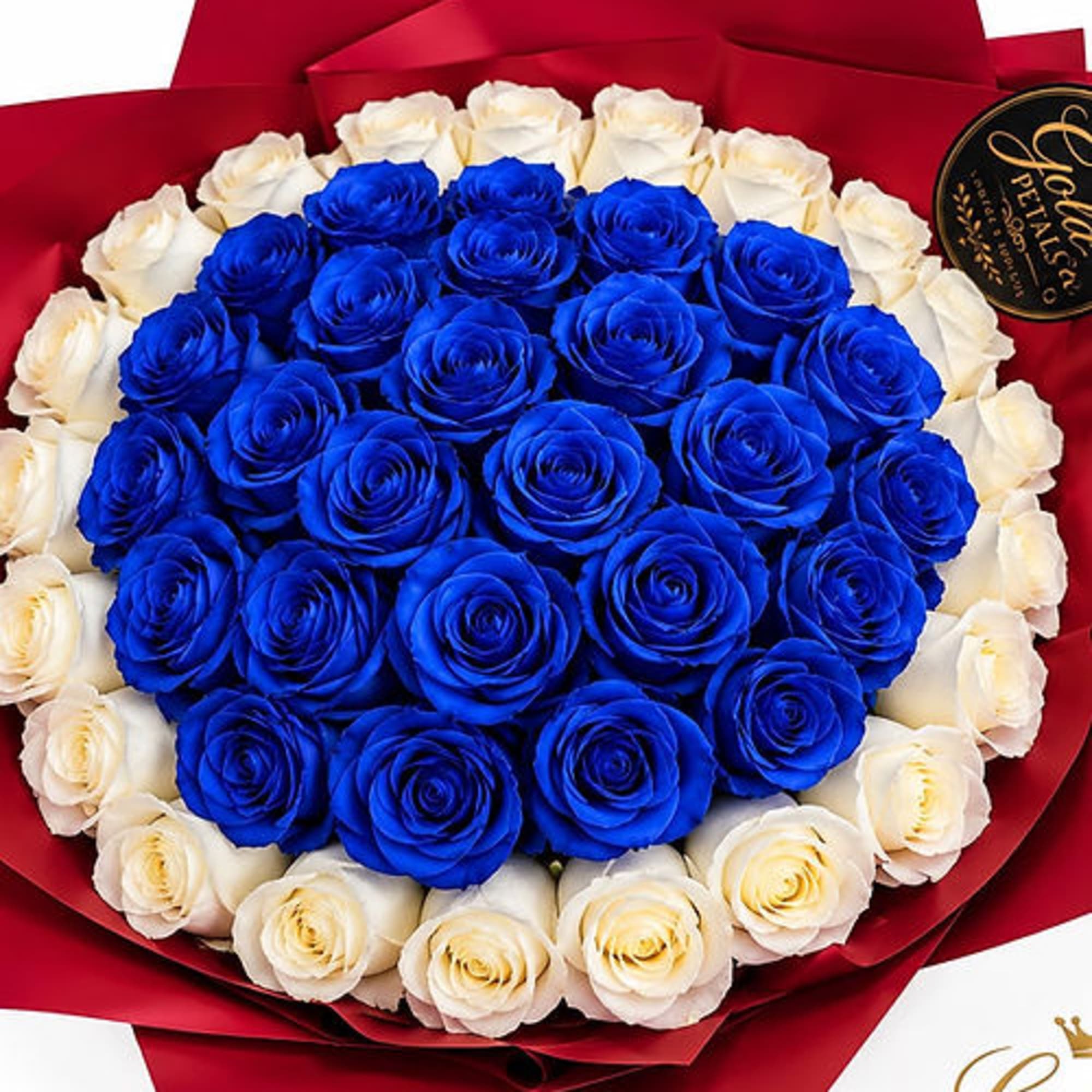 Bouquet of blue and white roses wrapped in red paper