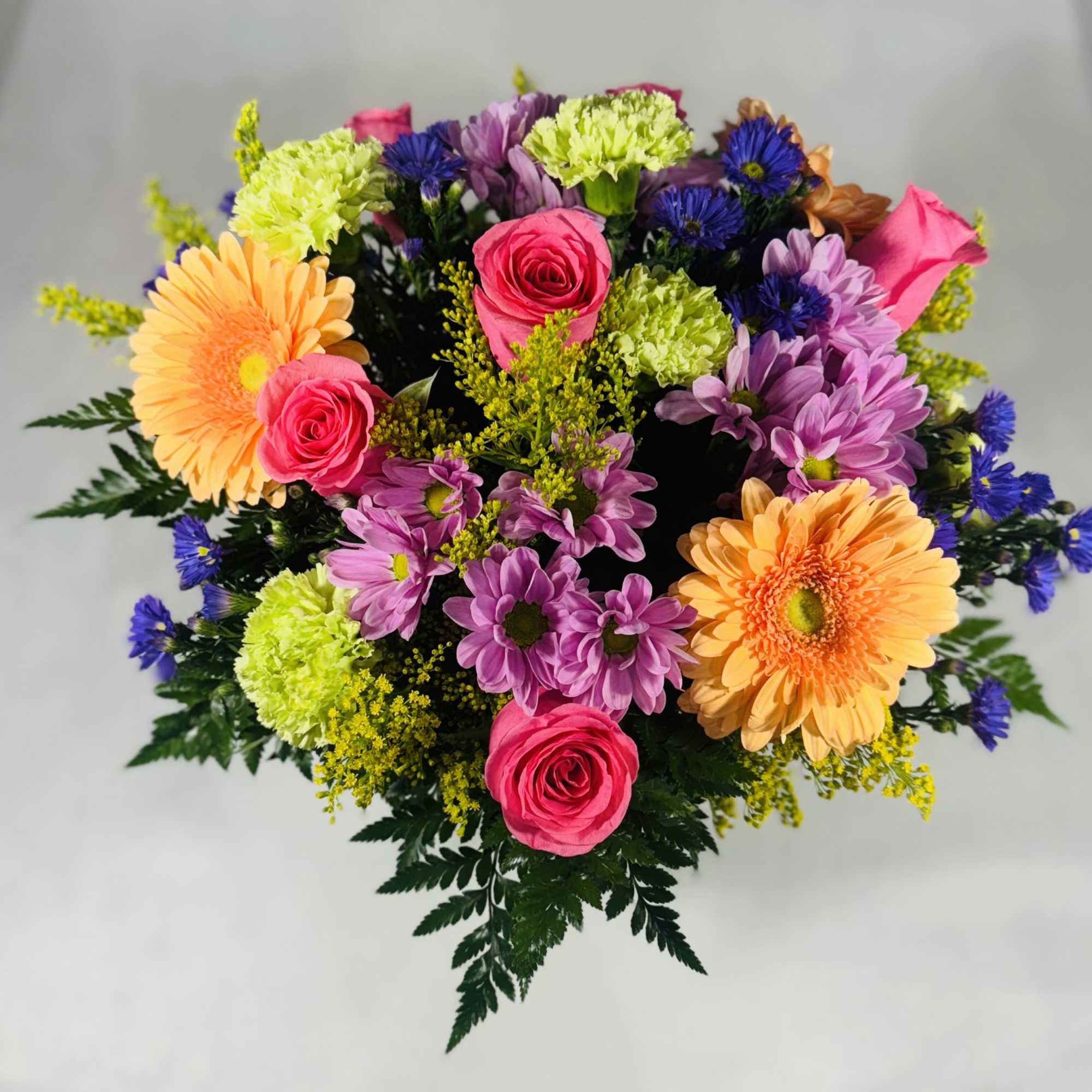 Colorful mixed bouquet with roses, gerbera daisies, and chrysanthemums
