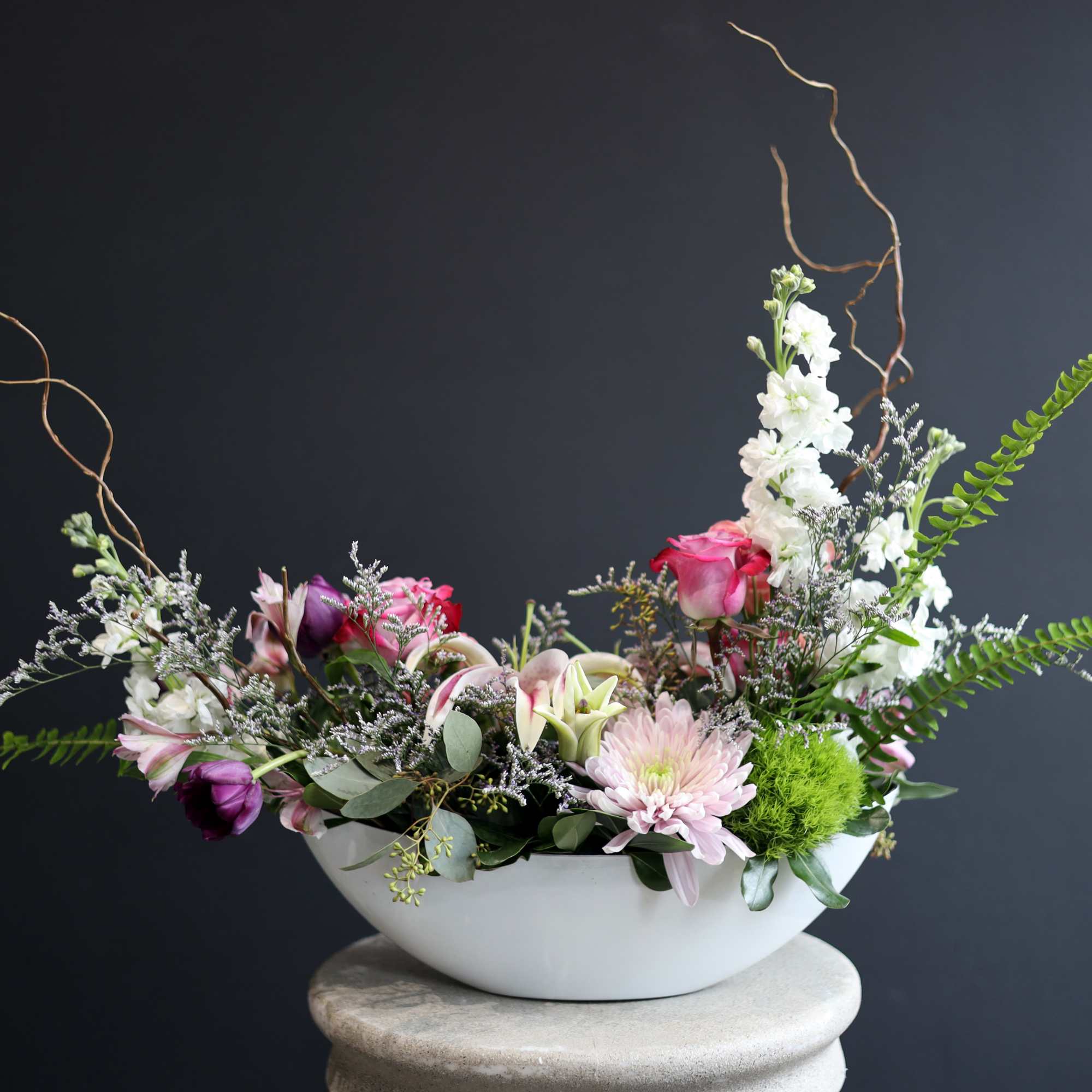 This boat vase is filled with lovely premium flowers! A few in