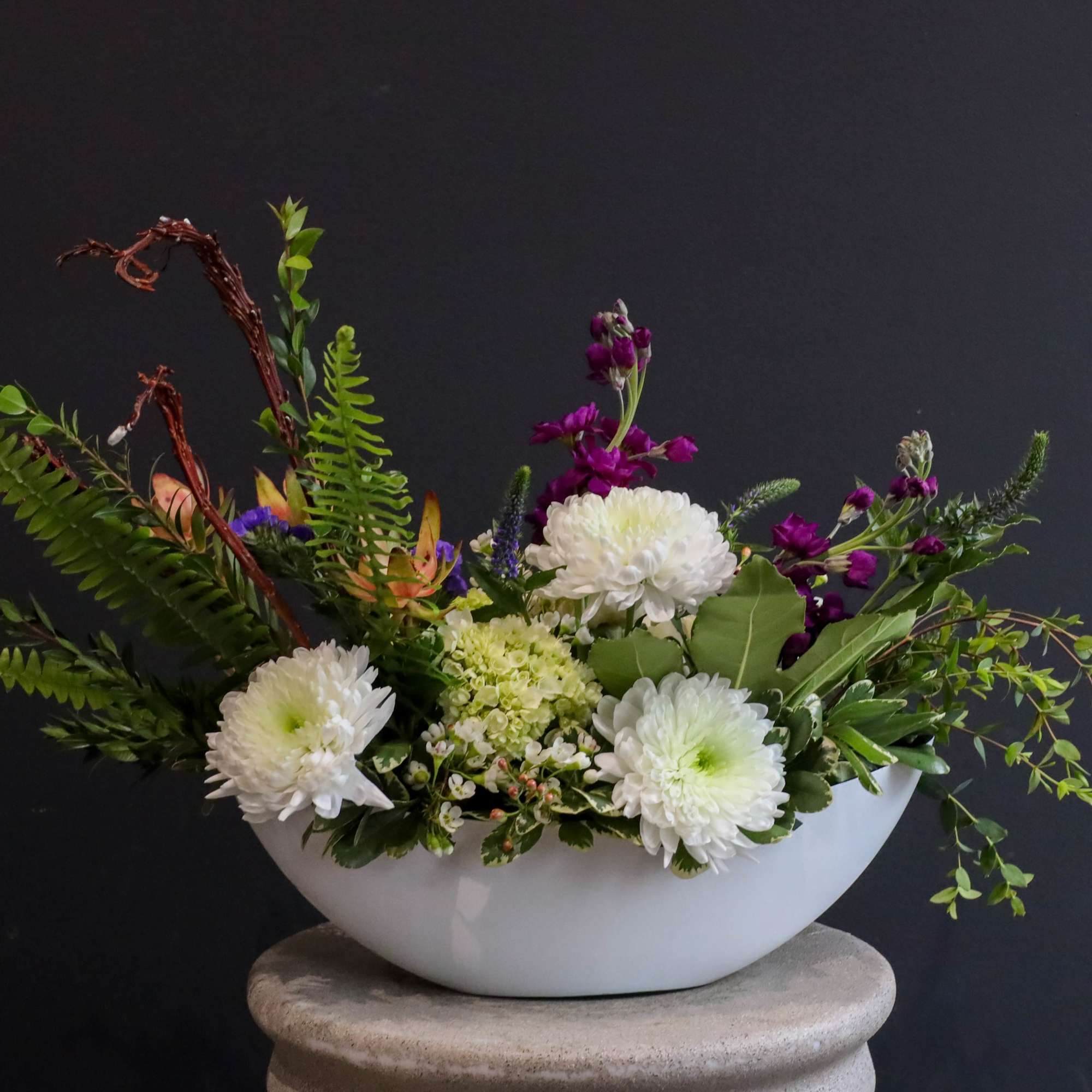 An artistically asymmetrical floral arrangement designed with the perfect flow in a