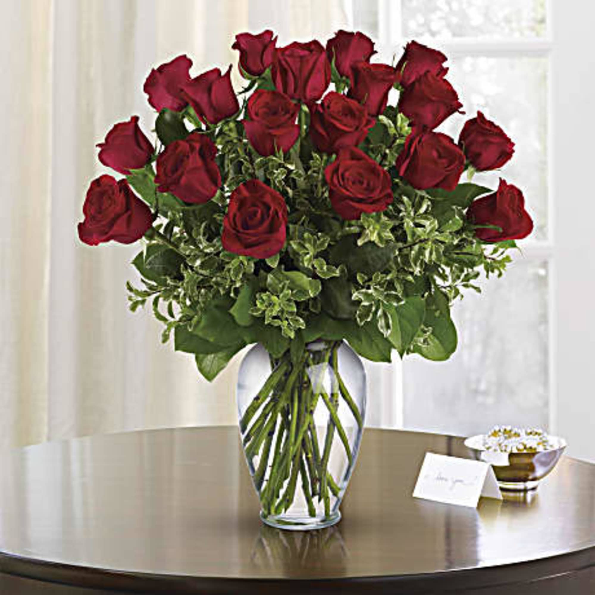 Bouquet of red roses in a clear glass vase
