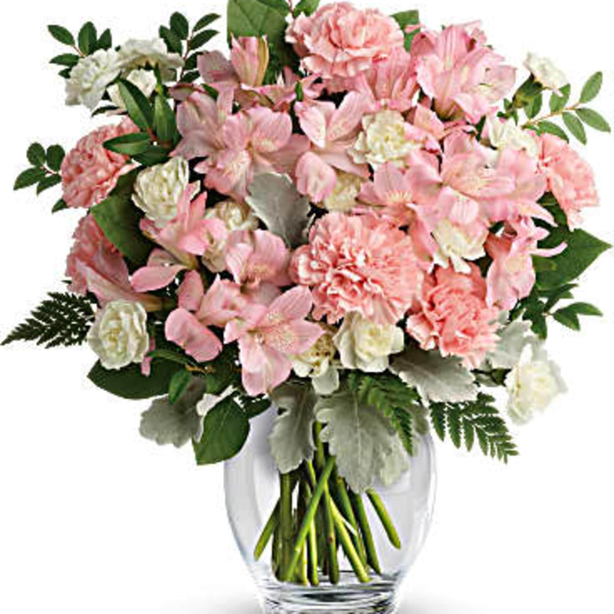 Pink and white mixed bouquet in a clear glass vase