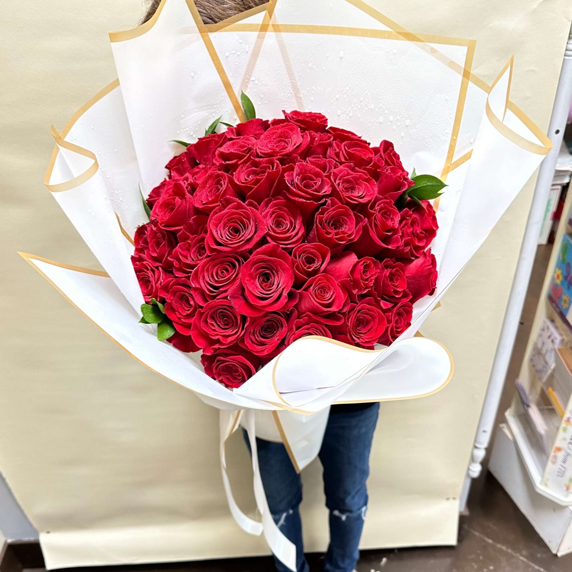 50 Elegant Red roses wrapped in a round shape for any perfect