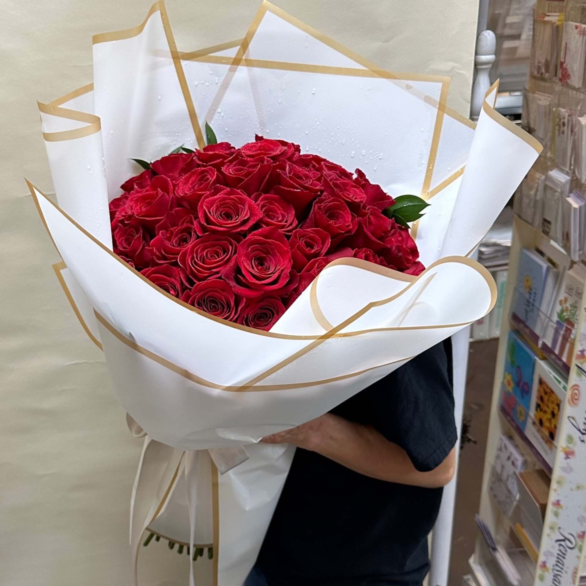 50 Elegant Red roses wrapped in a round shape for any perfect