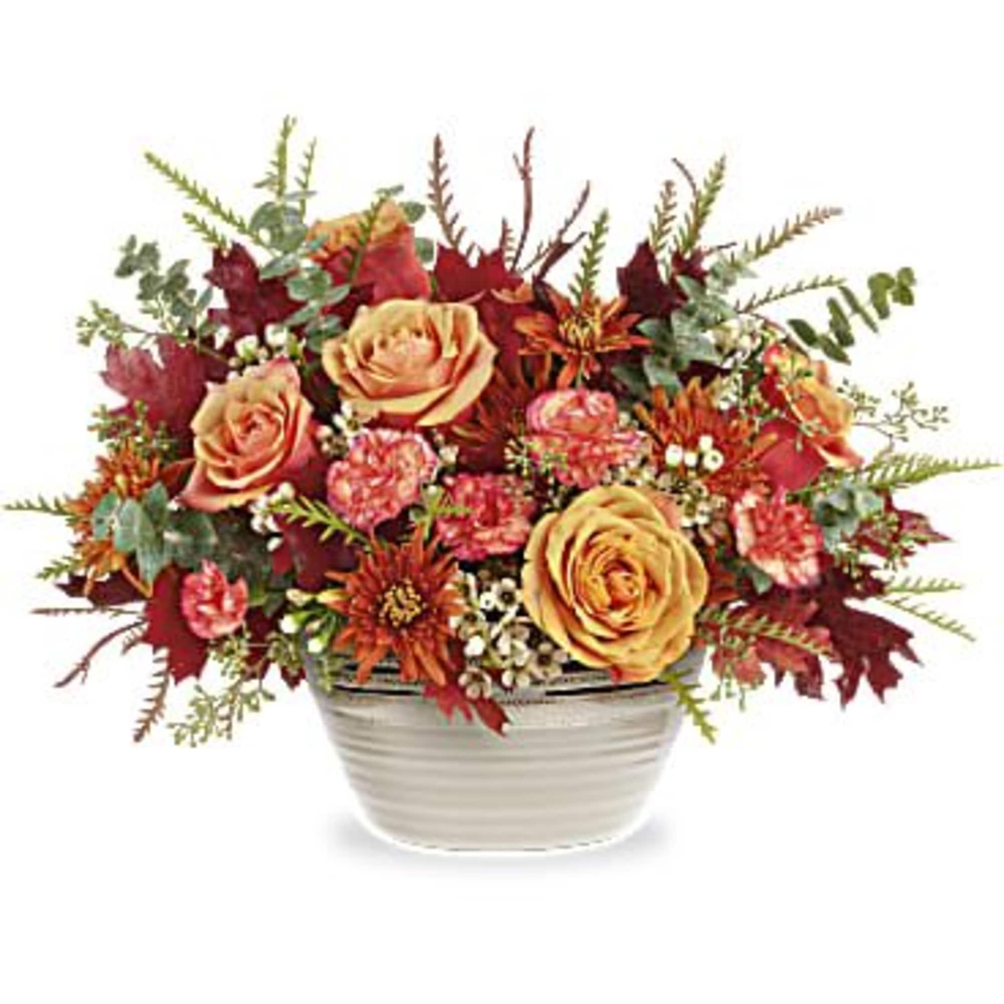 Autumn floral arrangement in a white ceramic bowl with roses and mums