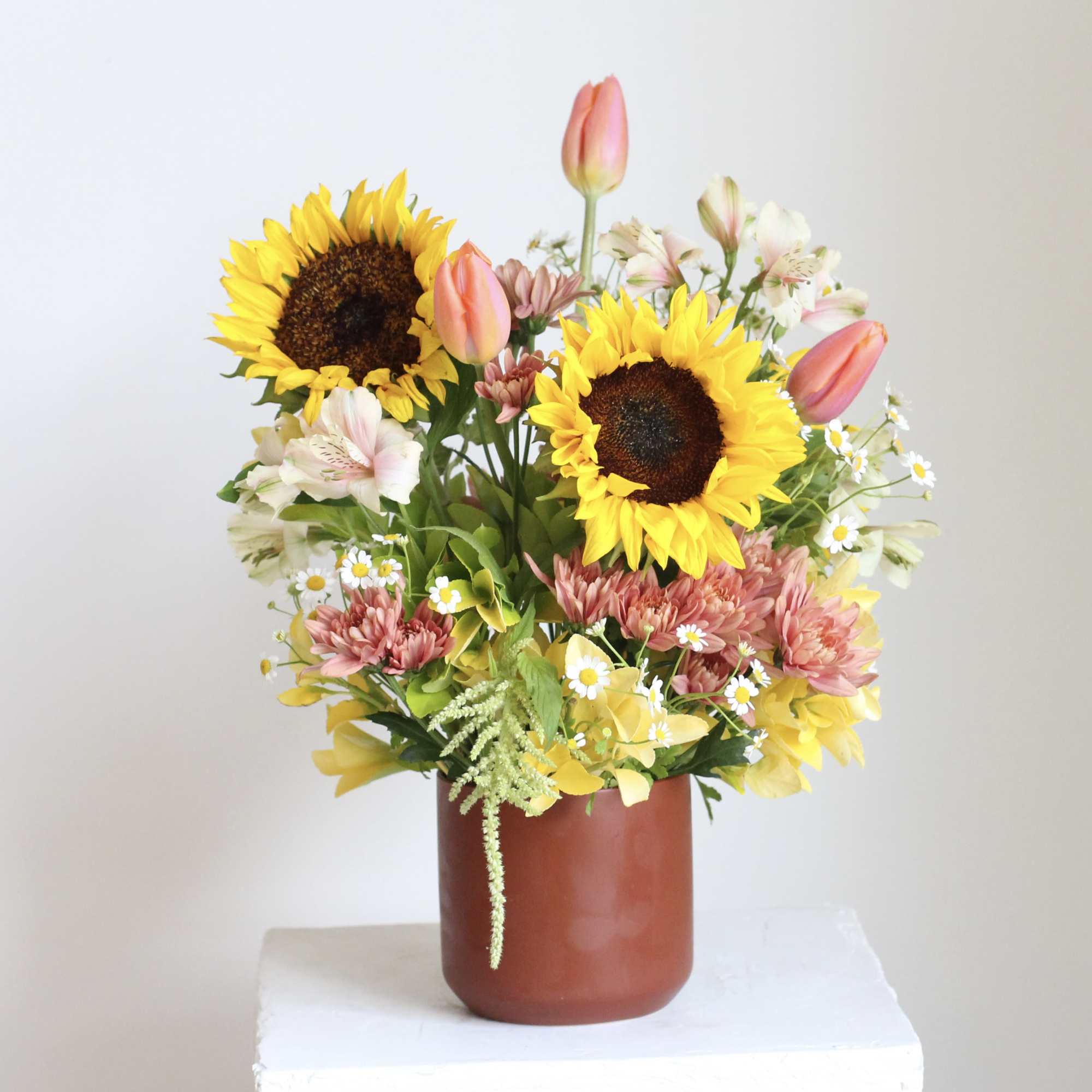 Earthy yet refined, our "Sweet and Sunny" floral arrangement for a radiant