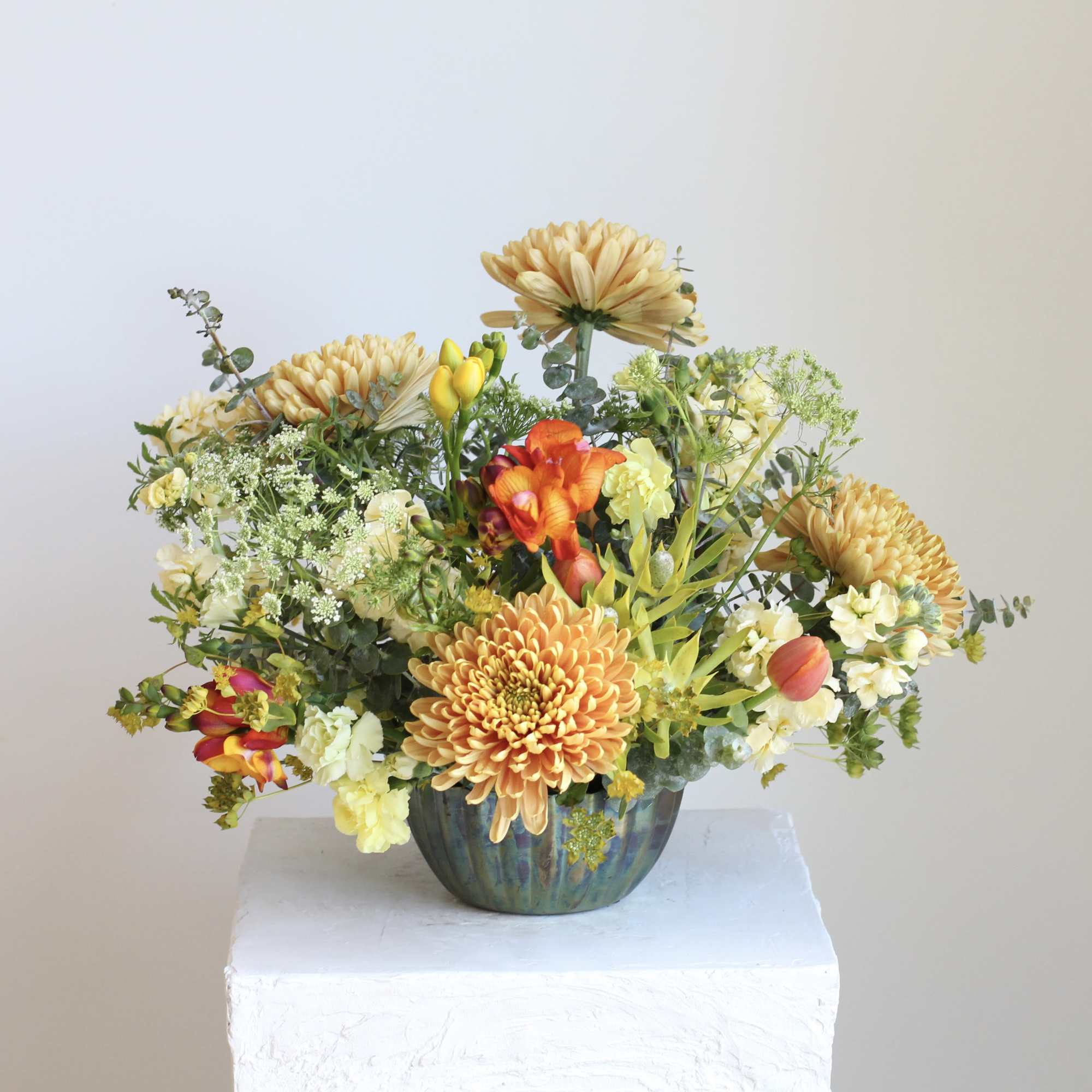 Meet &ldquo;Spring Oasis,&rdquo; a vibrant floral arrangement blending gold, fiery orange, and, photo 2 of 4