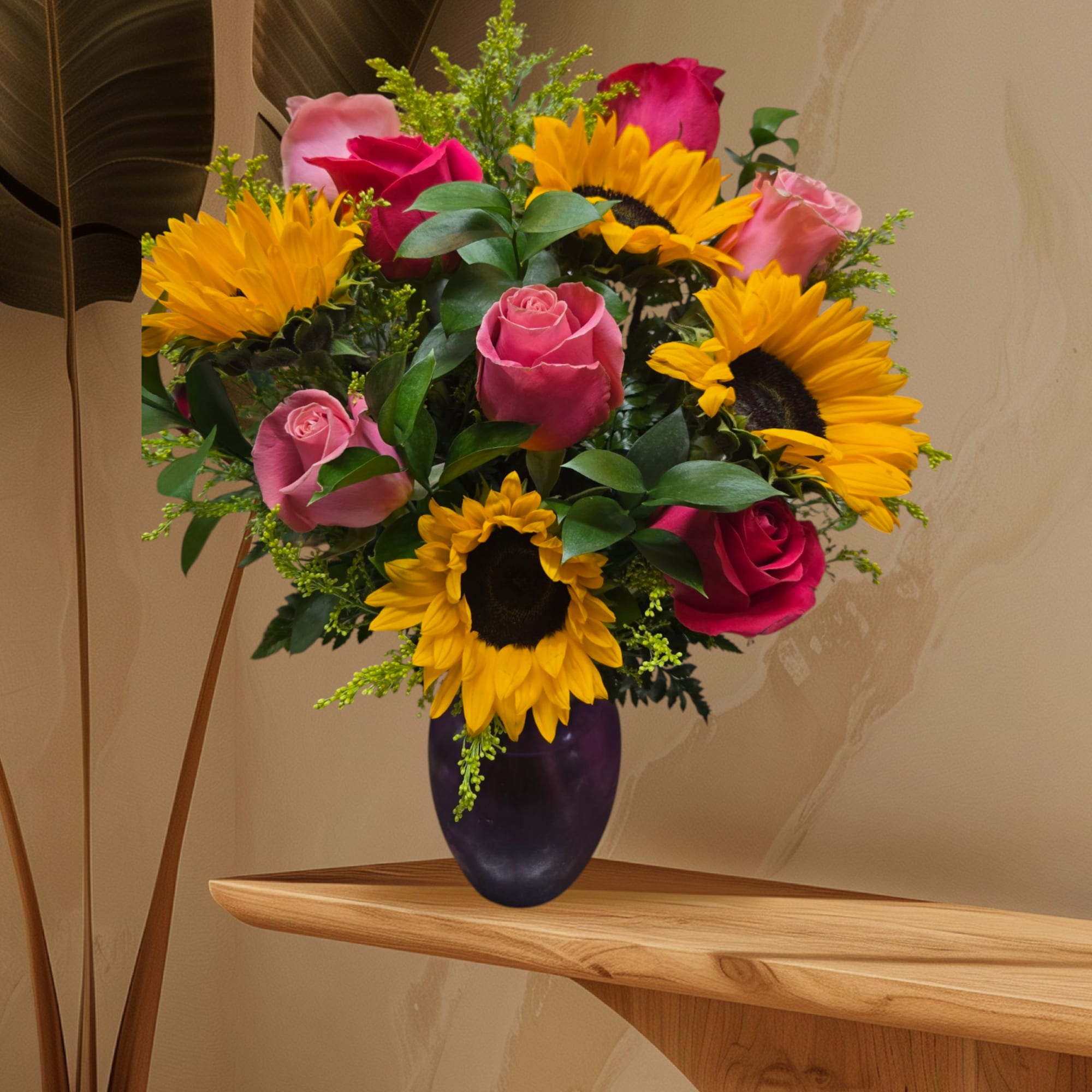 Bouquet of pink roses and sunflowers in a dark vase