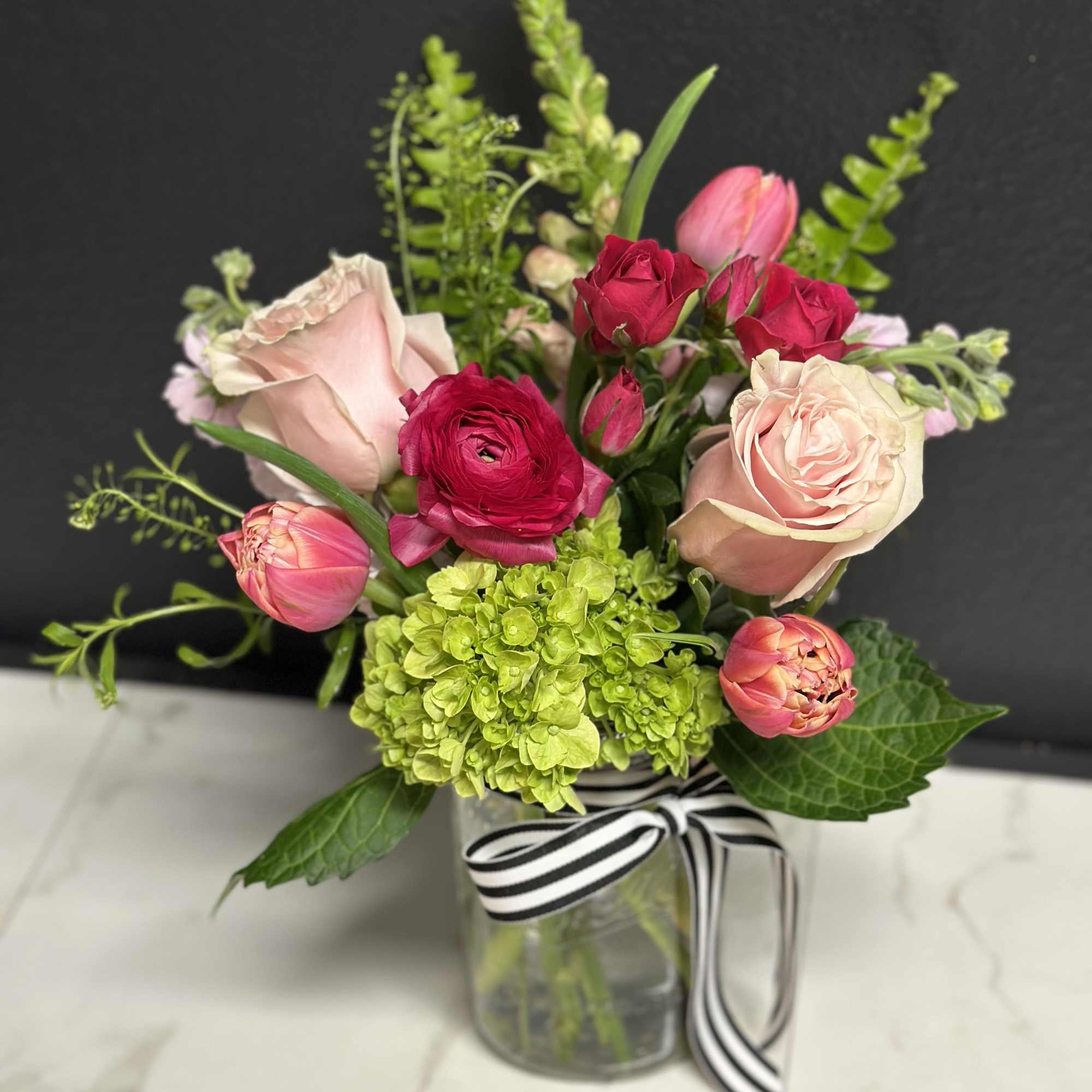 A pretty seasonal garden mix in shades of soft to hot pink.