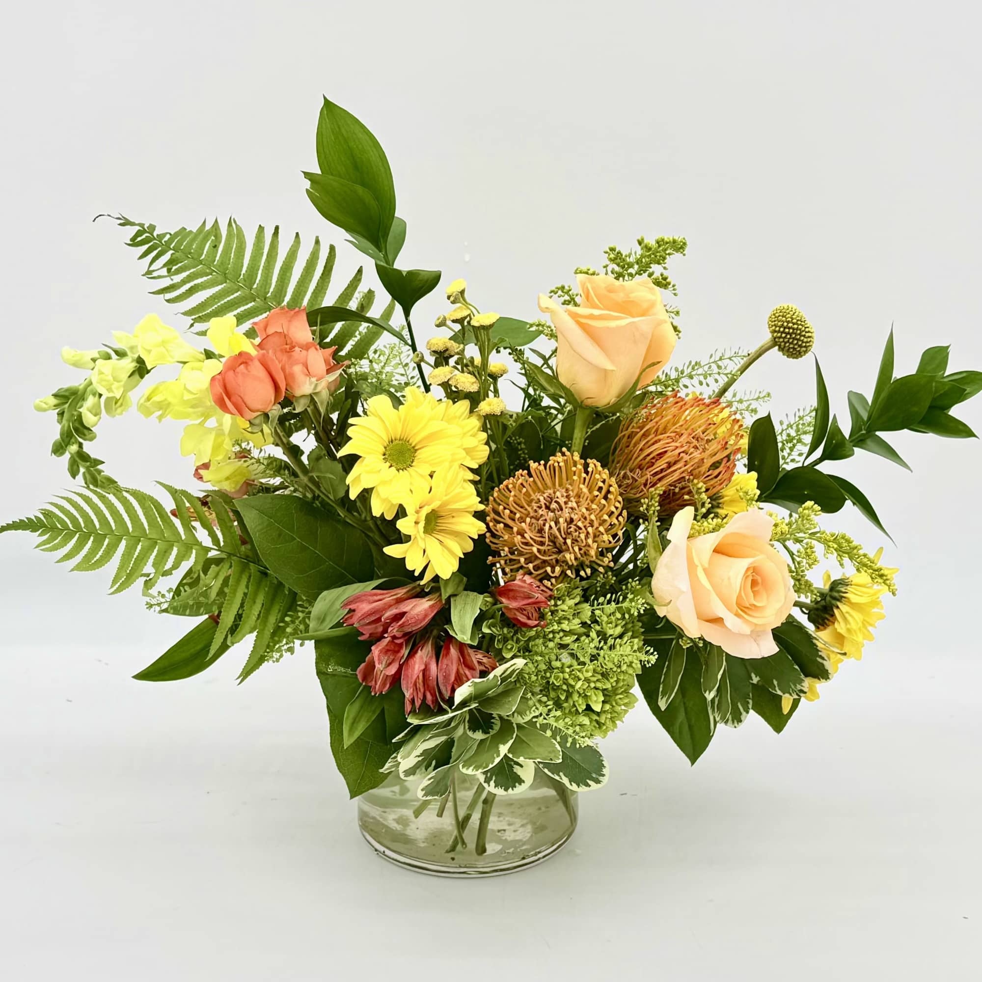 Citrus Zest is a bright, cheerful arrangement inspired by the fresh colors