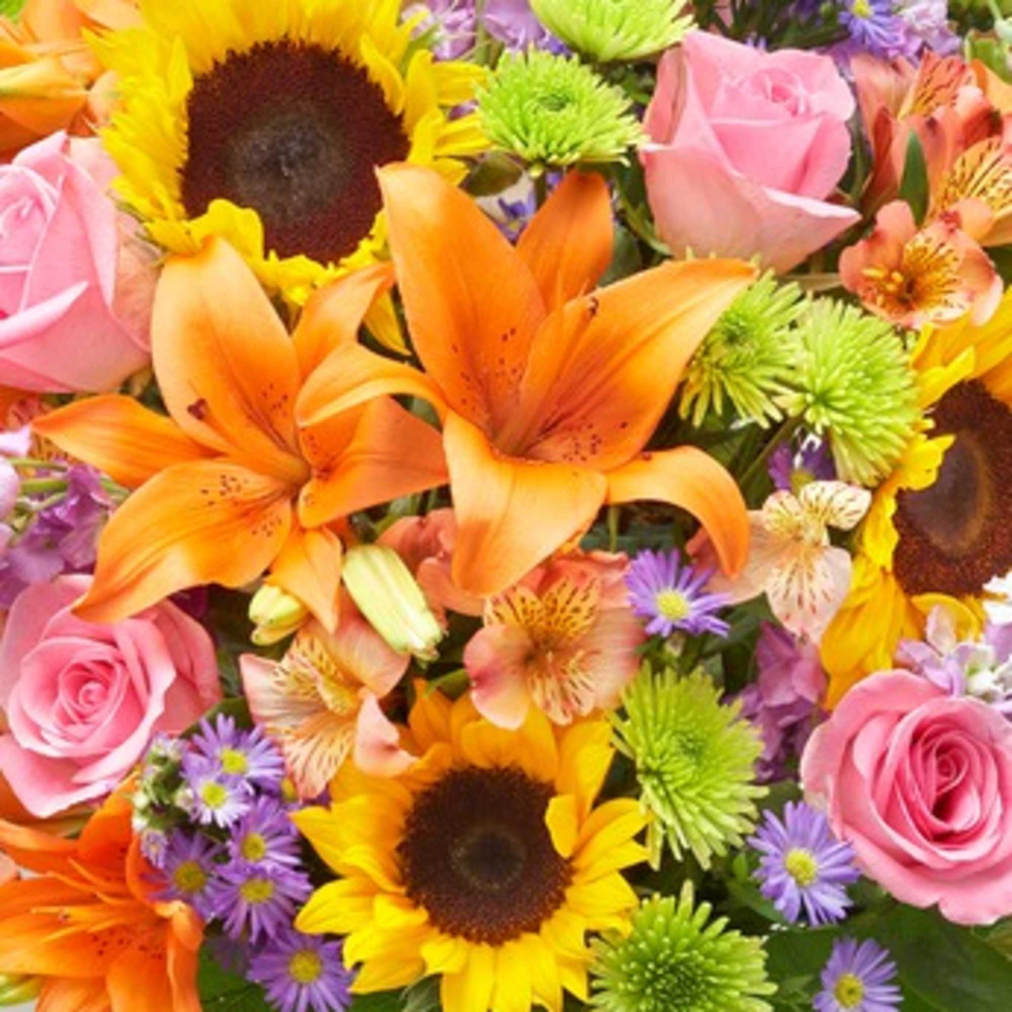 Colorful bouquet with sunflowers, orange lilies, and pink roses