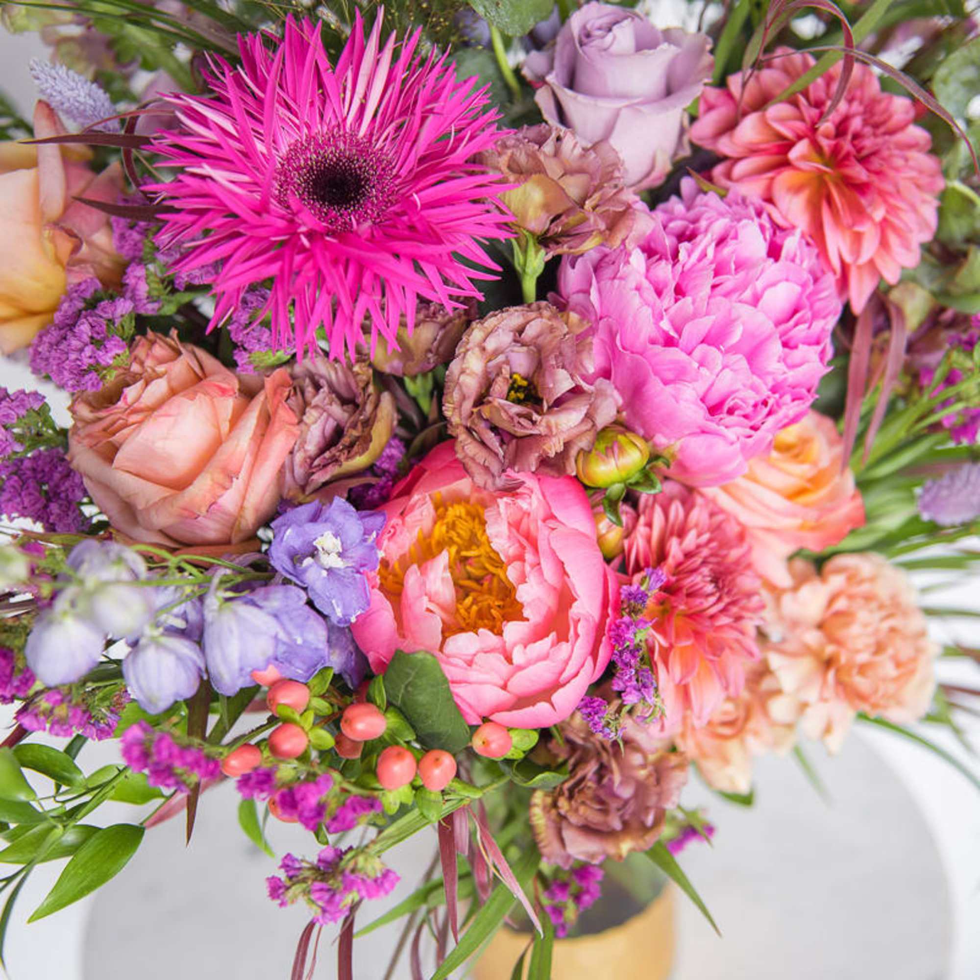 Mixed bouquet of pink, peach, and lavender flowers