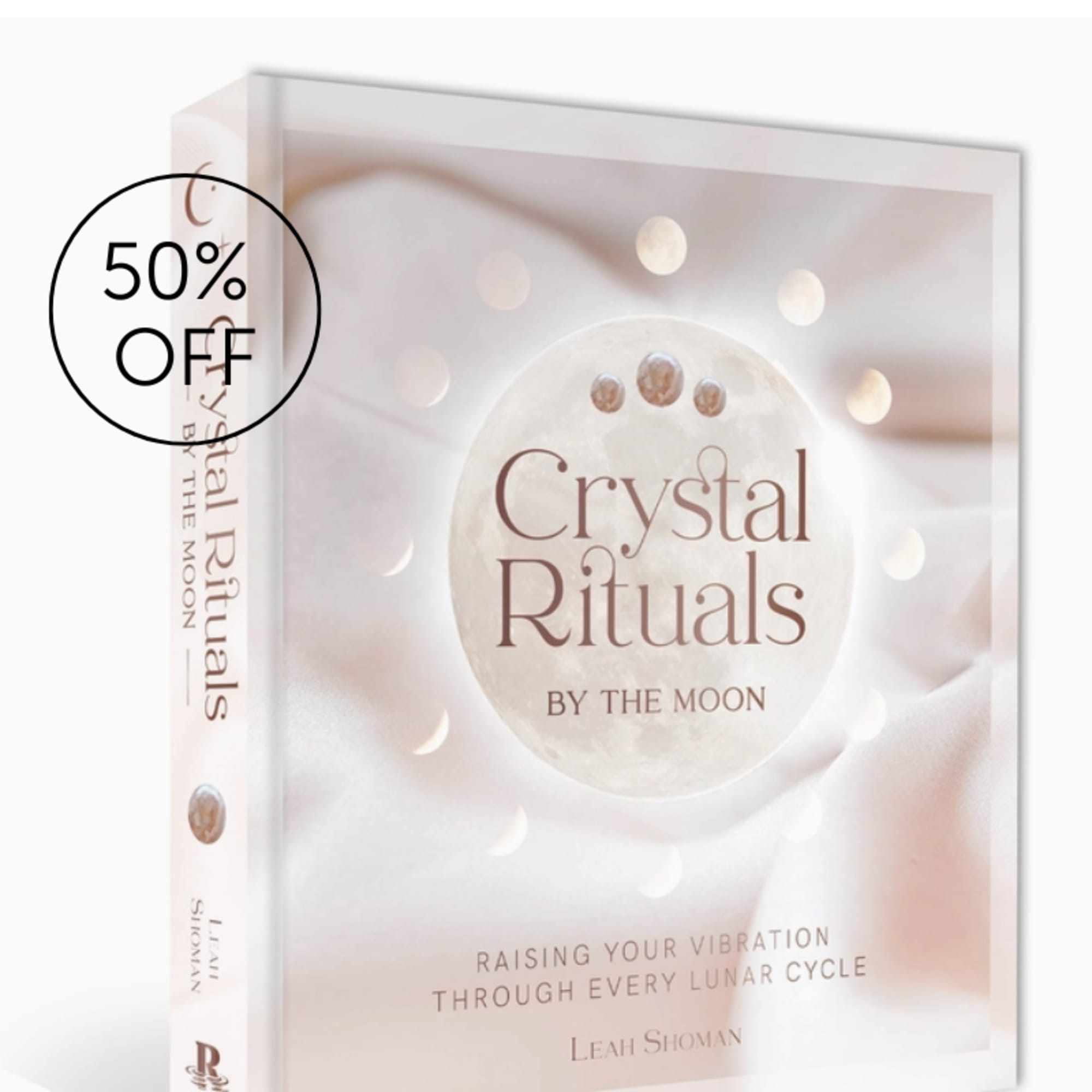 A boxed book titled Crystal Rituals with a 50% off sticker