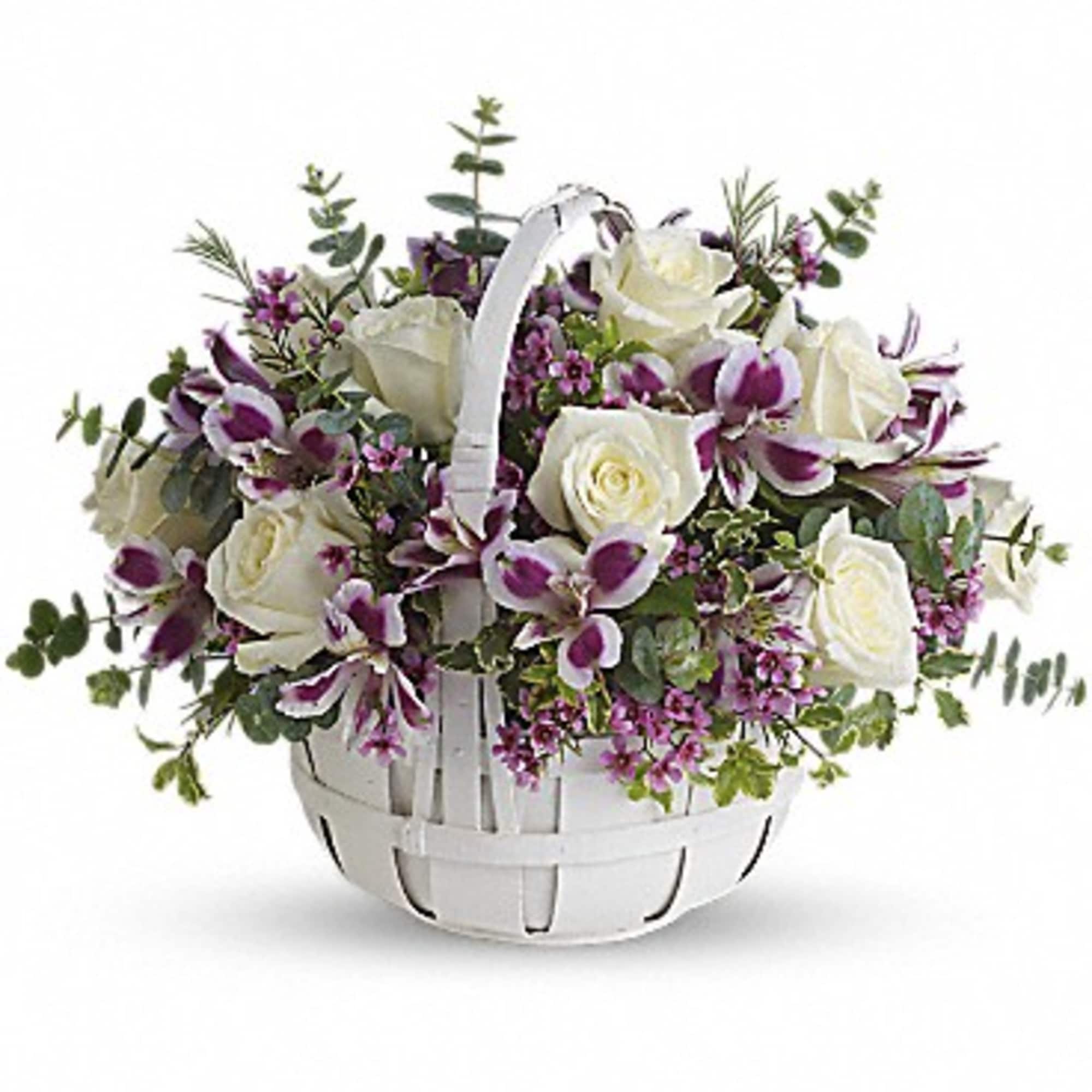 White basket of white roses and purple orchids