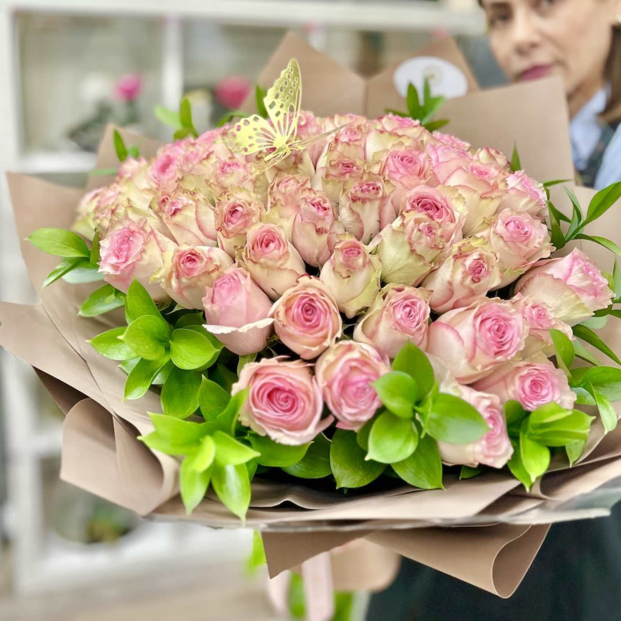 Artistically wrapped in our special Euro Floral paper accented with a decorated