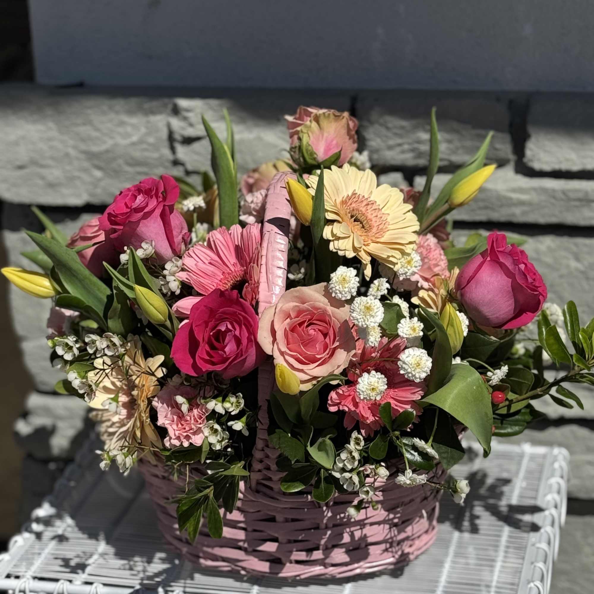 Pink and peach mixed flower basket with roses and gerbera daisies