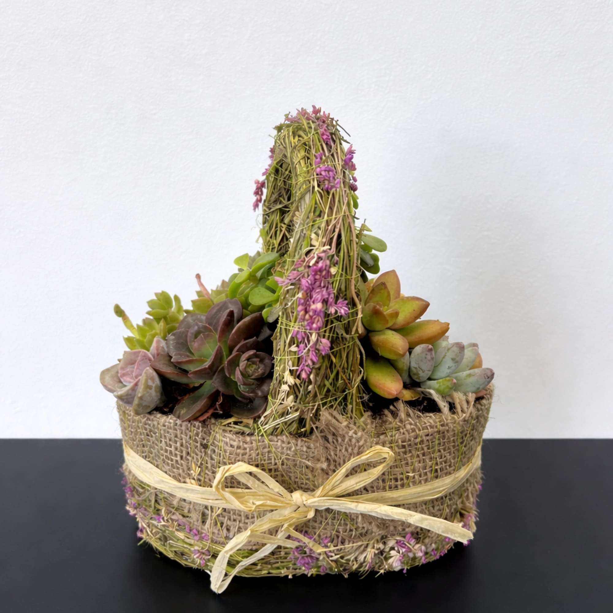 The sweetest little succulent basket styled in soft burlap with natural moss, photo 2 of 2