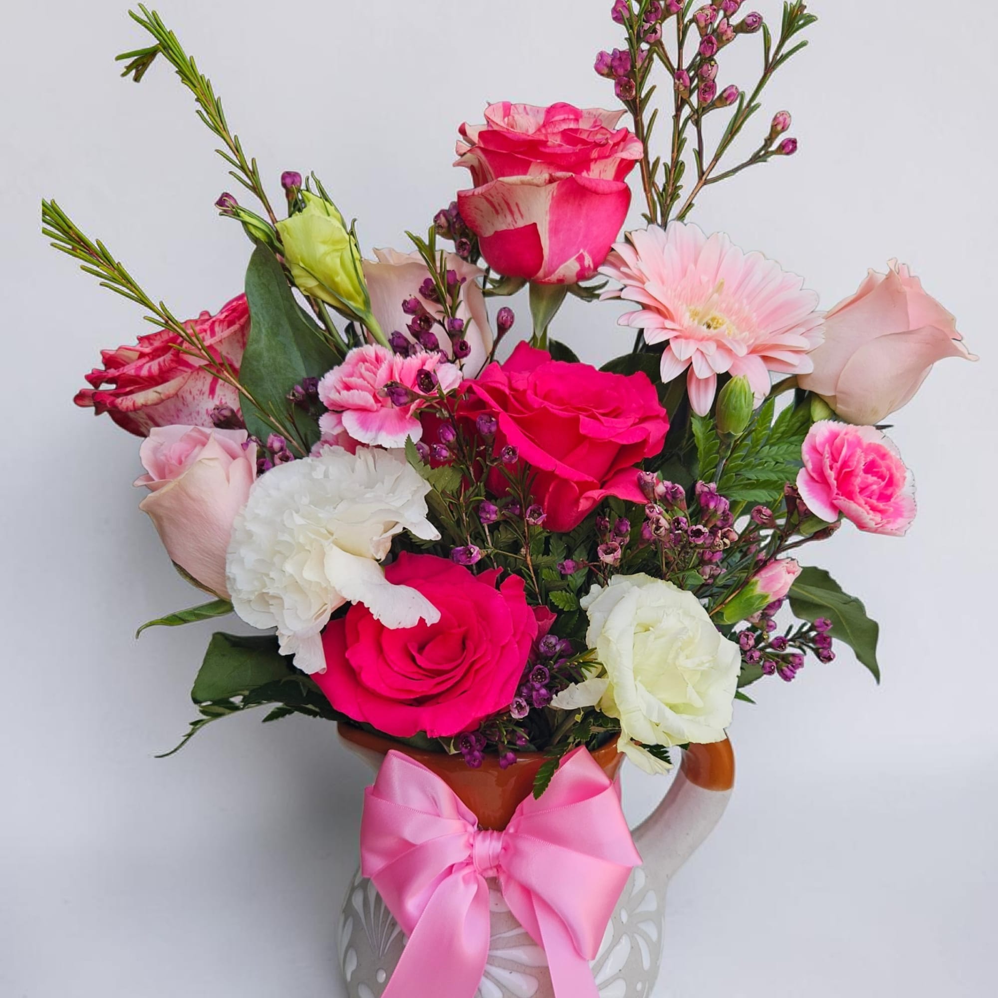 Bright, playful color takes center stage in this mixed flower arrangement-perfect as