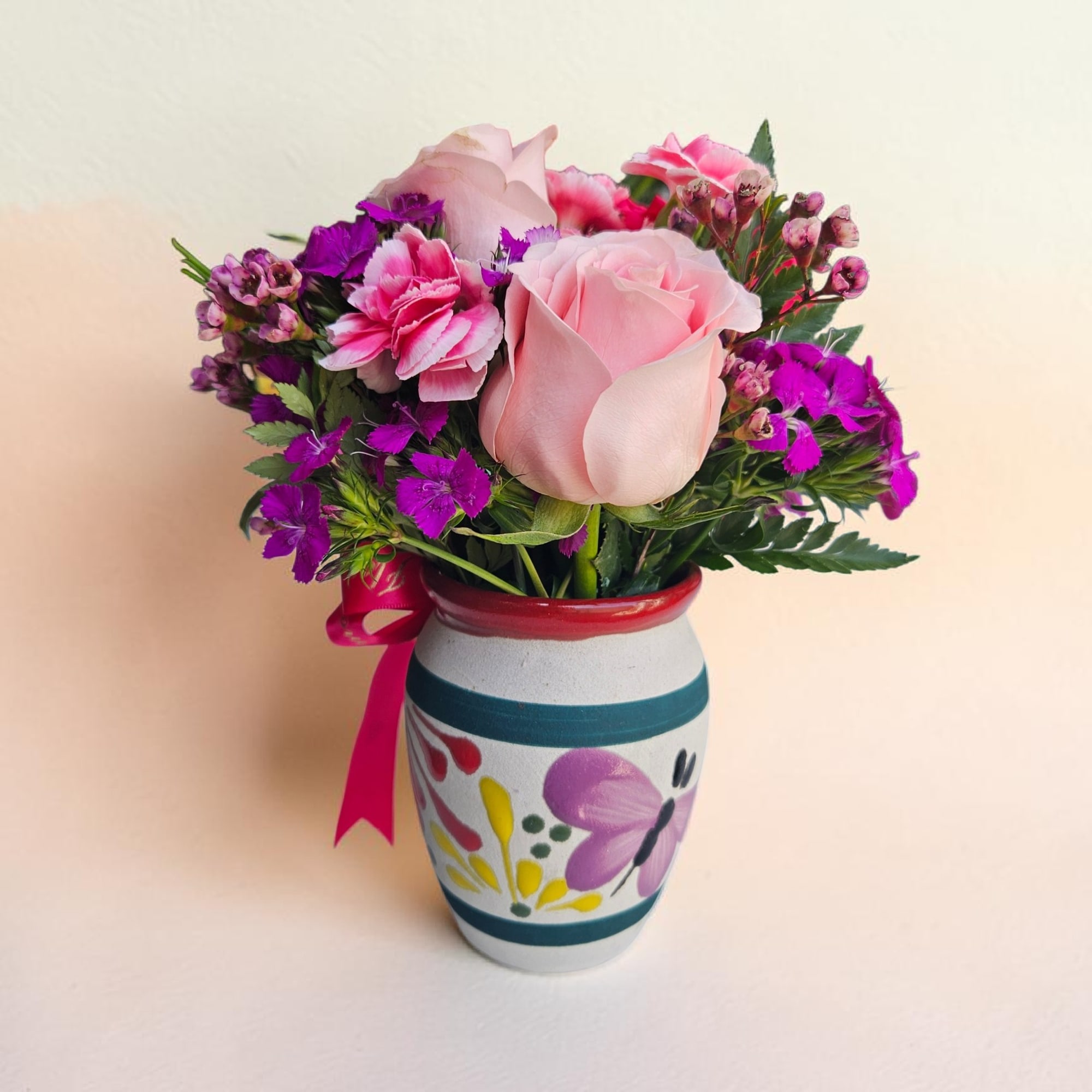 A joyful cluster of roses and carnations in soft peach, pale pink, photo 2 of 2