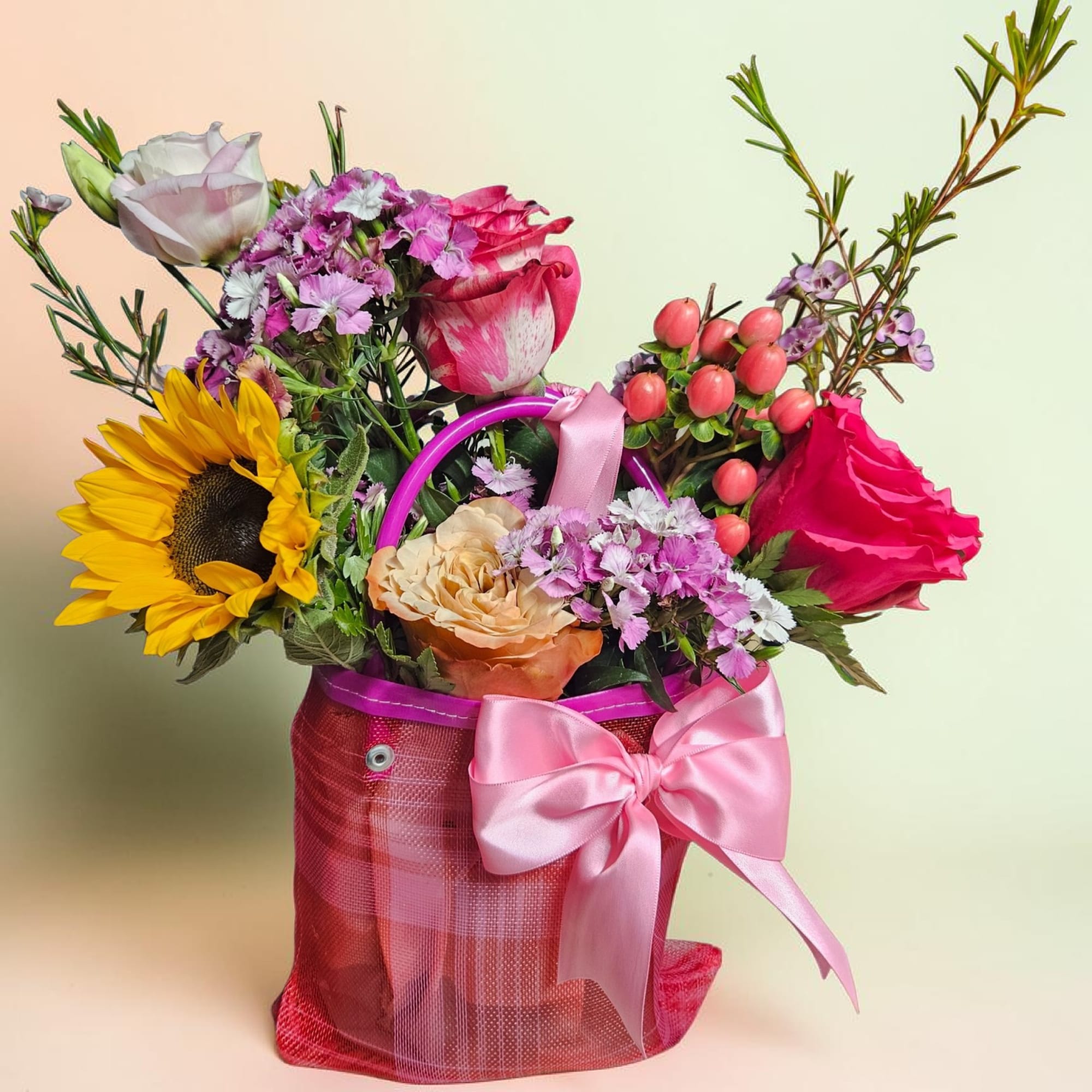 A bright sunflower crowns this Mini Mexican flower bag, making it a