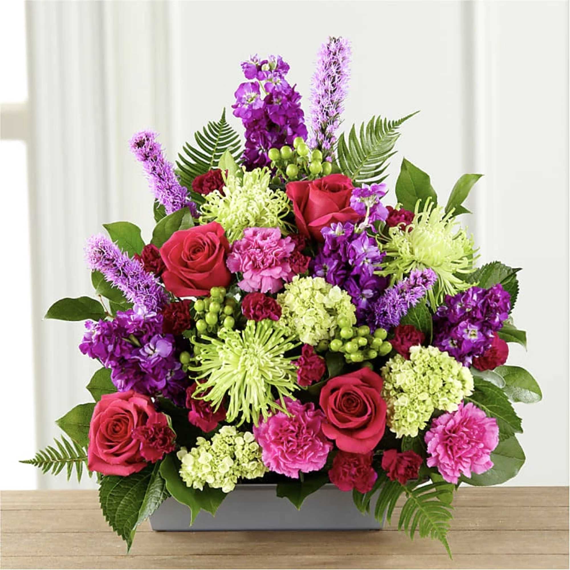WARM EMBRACE ARRANGEMENT
A lovely way to say, "farewell," this bright, beautiful arrangement
