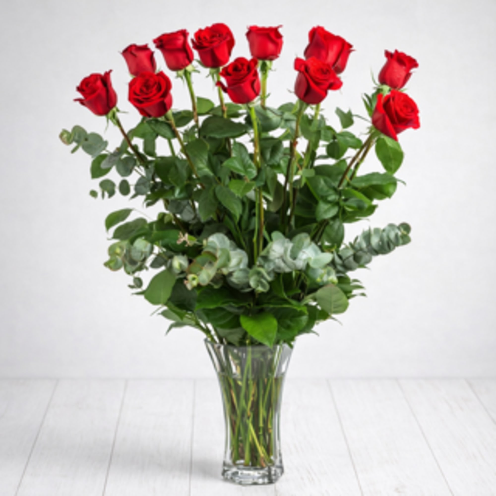 Product Description

This classic dozen red roses Valentine&rsquo;s Day flower arrangement in a