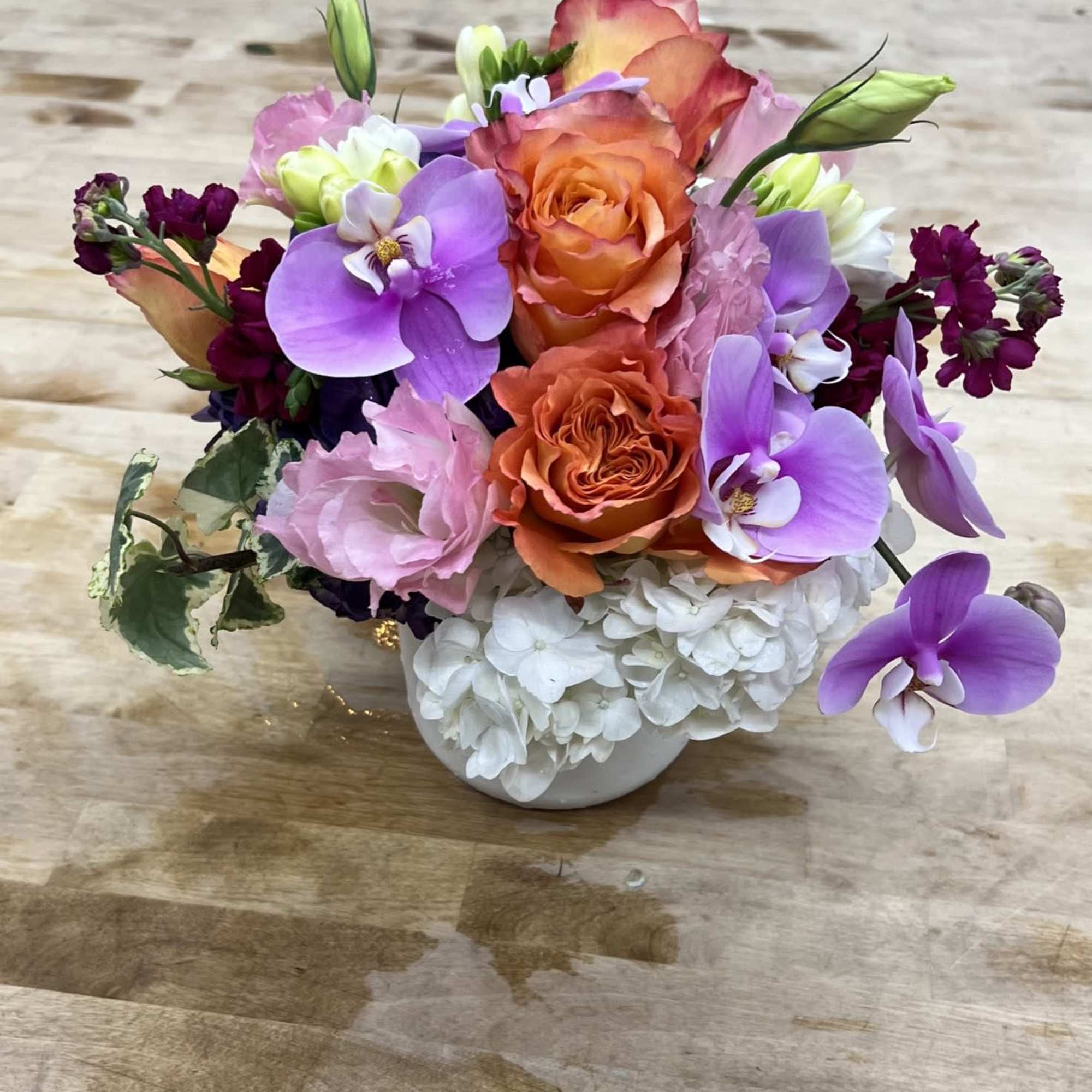 A bright lavender Phalaenopsis orchid anchored in the center gives this compact, photo 2 of 2