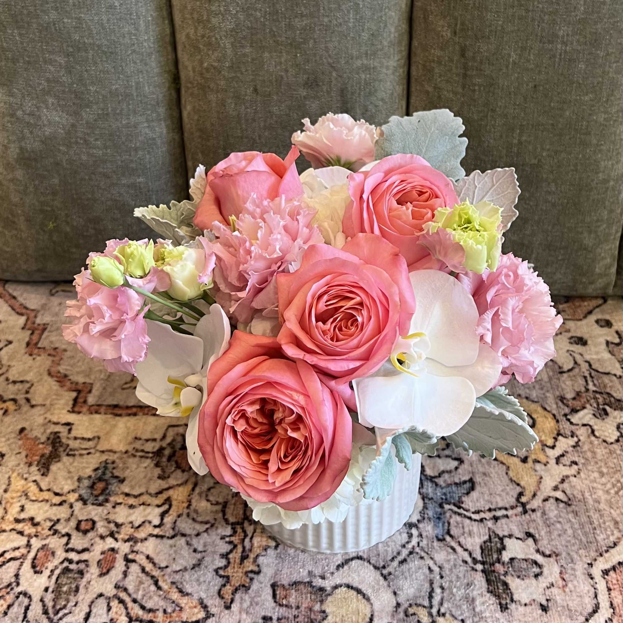 Coral-pink roses take center stage in this Pink Punch flower arrangement, surrounded, photo 2 of 2