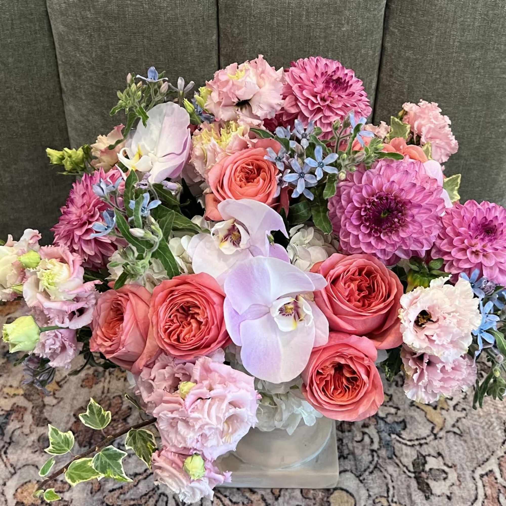 A lush, garden-style centerpiece that reads like a breath of spring-this floral, photo 2 of 2