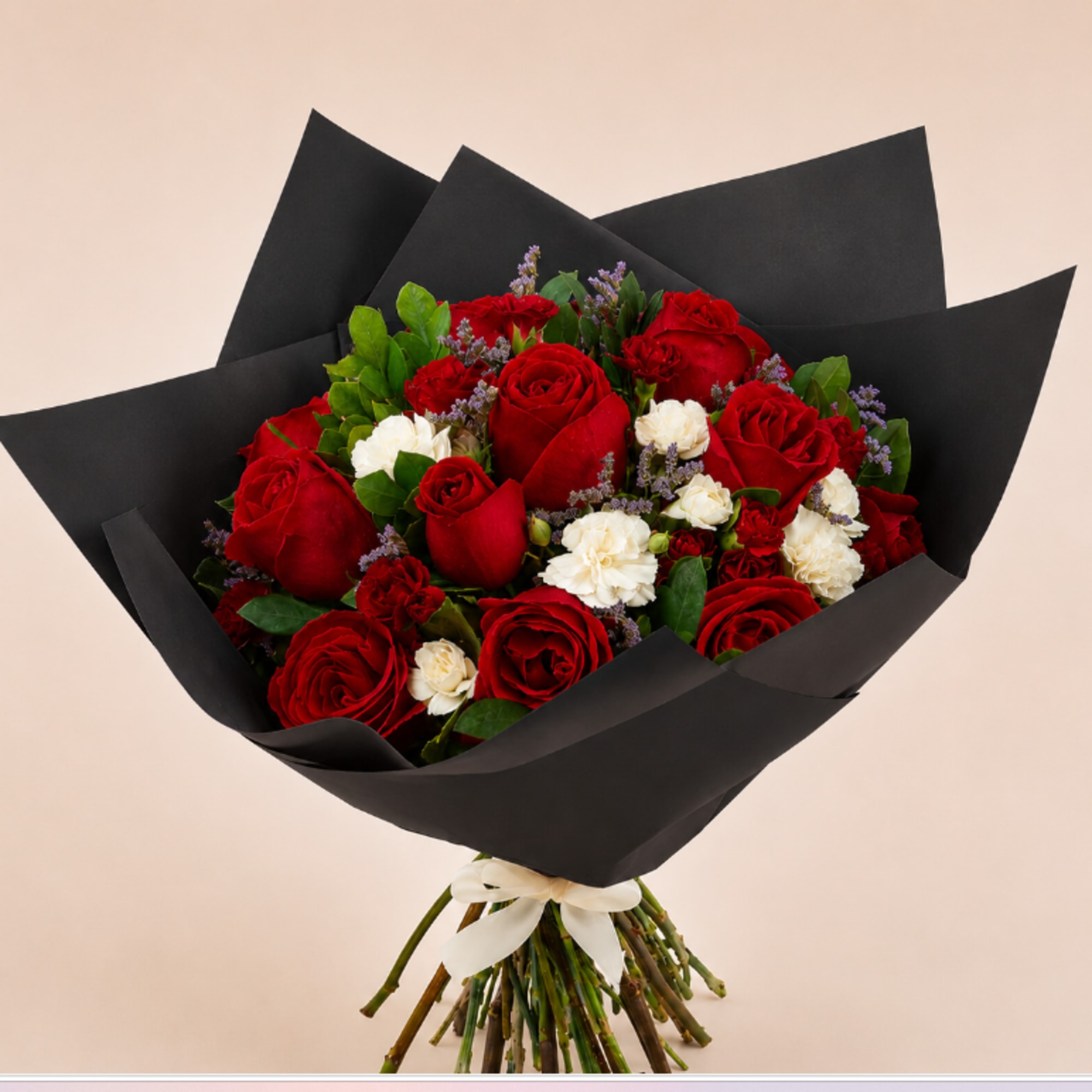 Bouquet of red and white roses wrapped in black paper