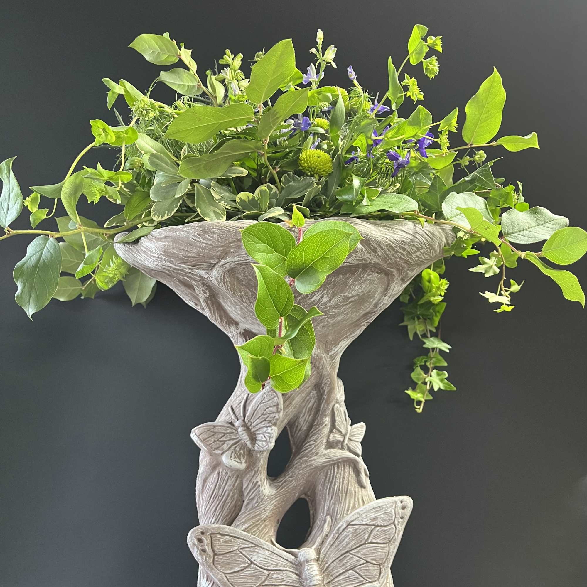Solid concrete birdbath will look beautiful in the front or back yard.