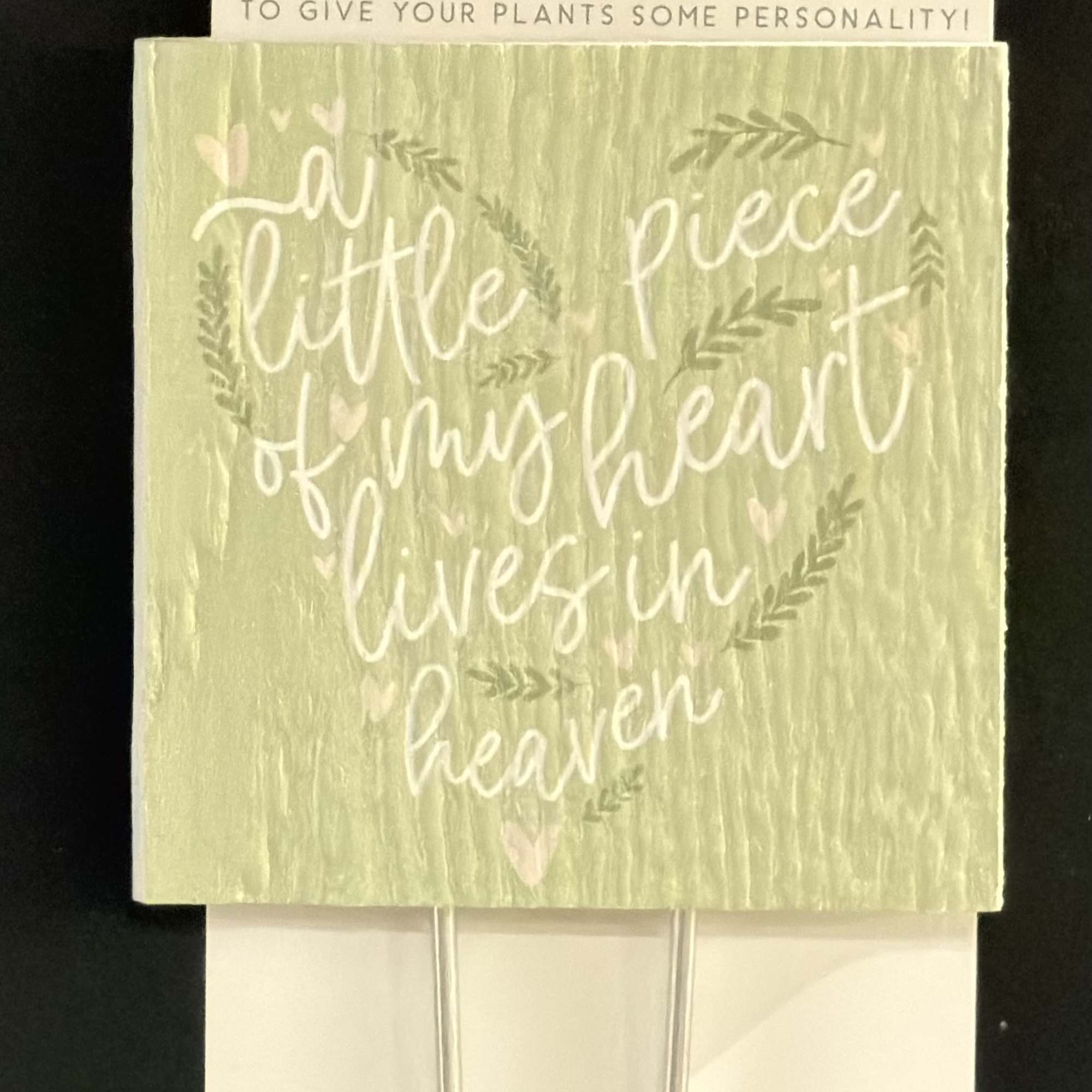 Packaged plant stake with the phrase "a little piece of my heart lives in heaven"