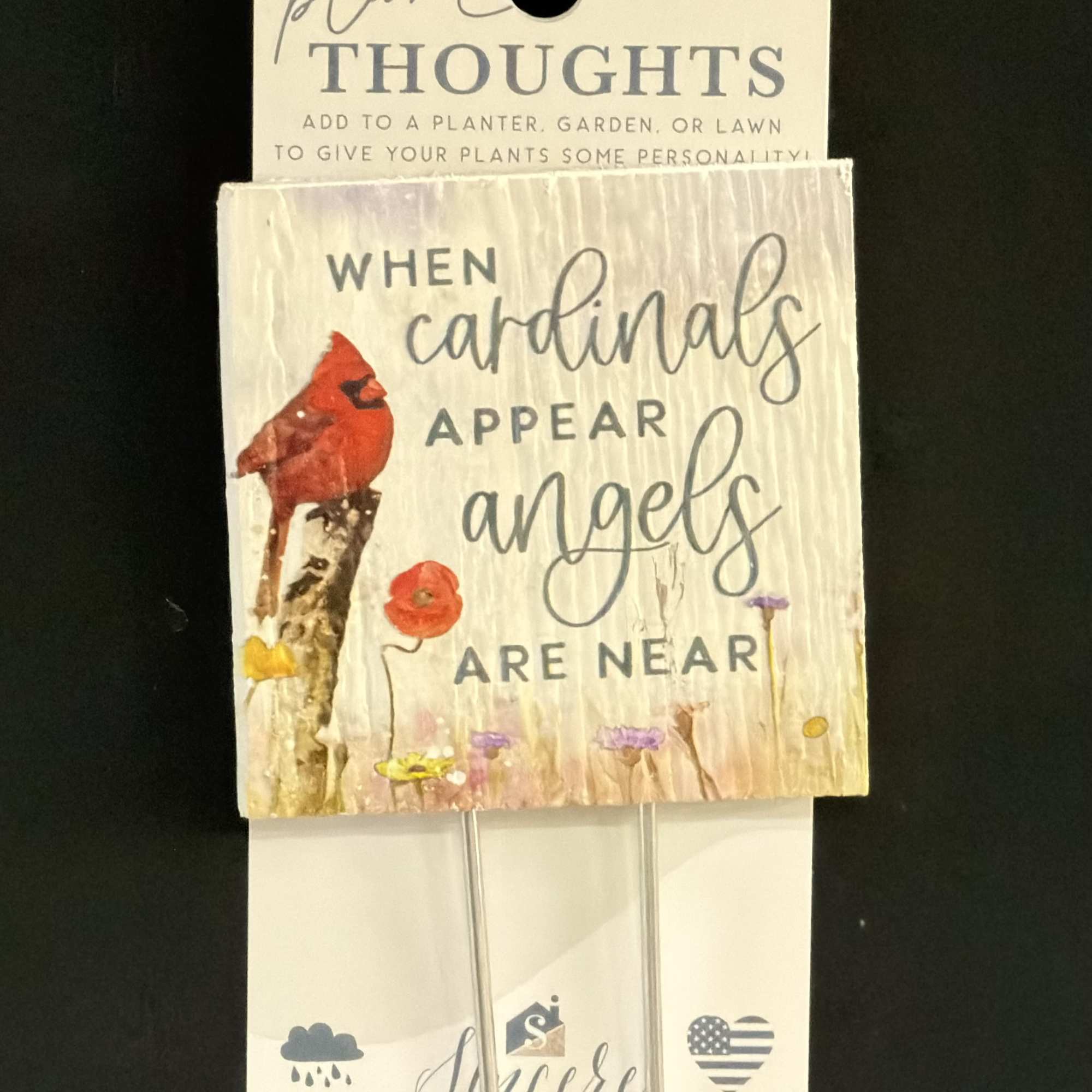 Decorative plant stake with a cardinal and quote on a card